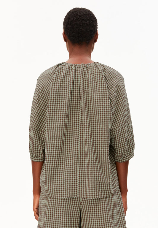 Model backside in green and brown check cotton shirt and shorts for Kelowna and Canada
