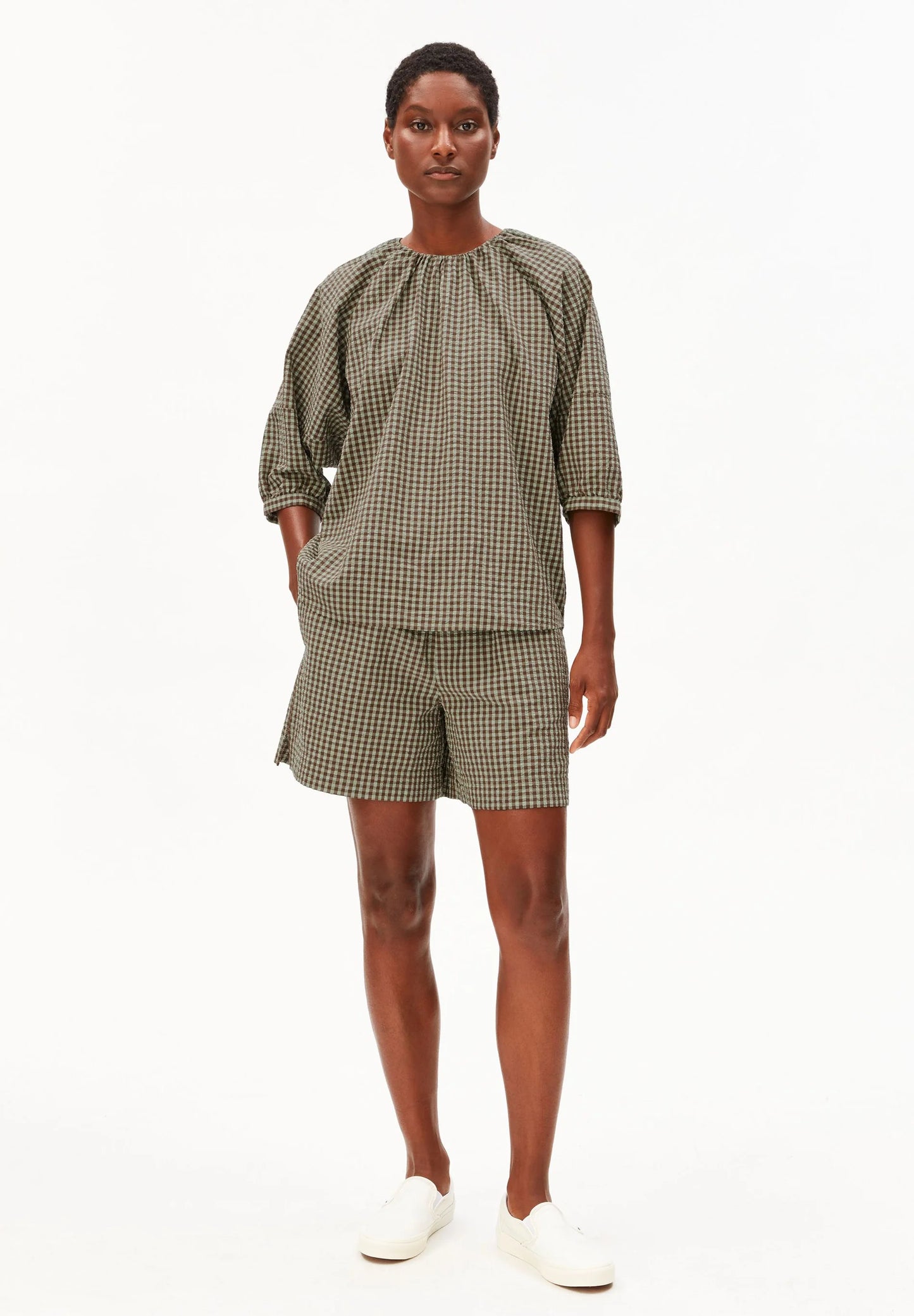 Full model shot in green and brown check cotton shirt and shorts for Kelowna and Canada