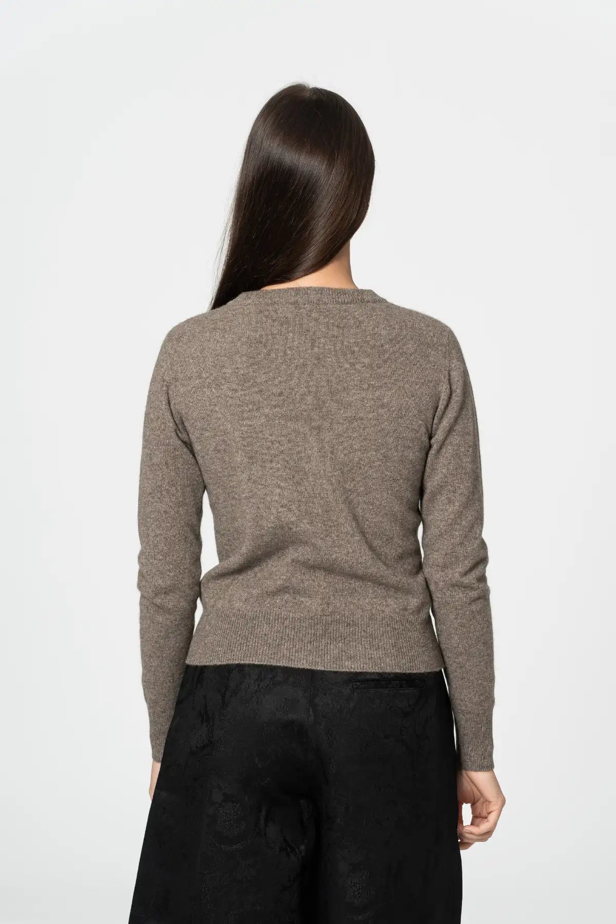 Back view of a Dinadi cardigan in a soft brown hue, perfect for layering and versatility in Kelowna and Canada