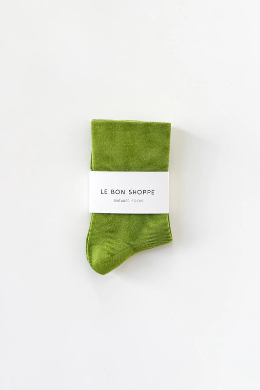 Green sock with a white label on a white background
