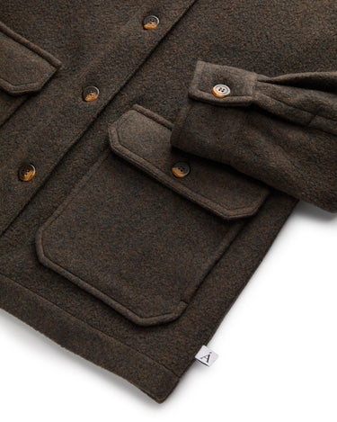Anian jackets brown wool jacket with button flap pockets and button cuff close up showing fabric texture and brand in Kelowna