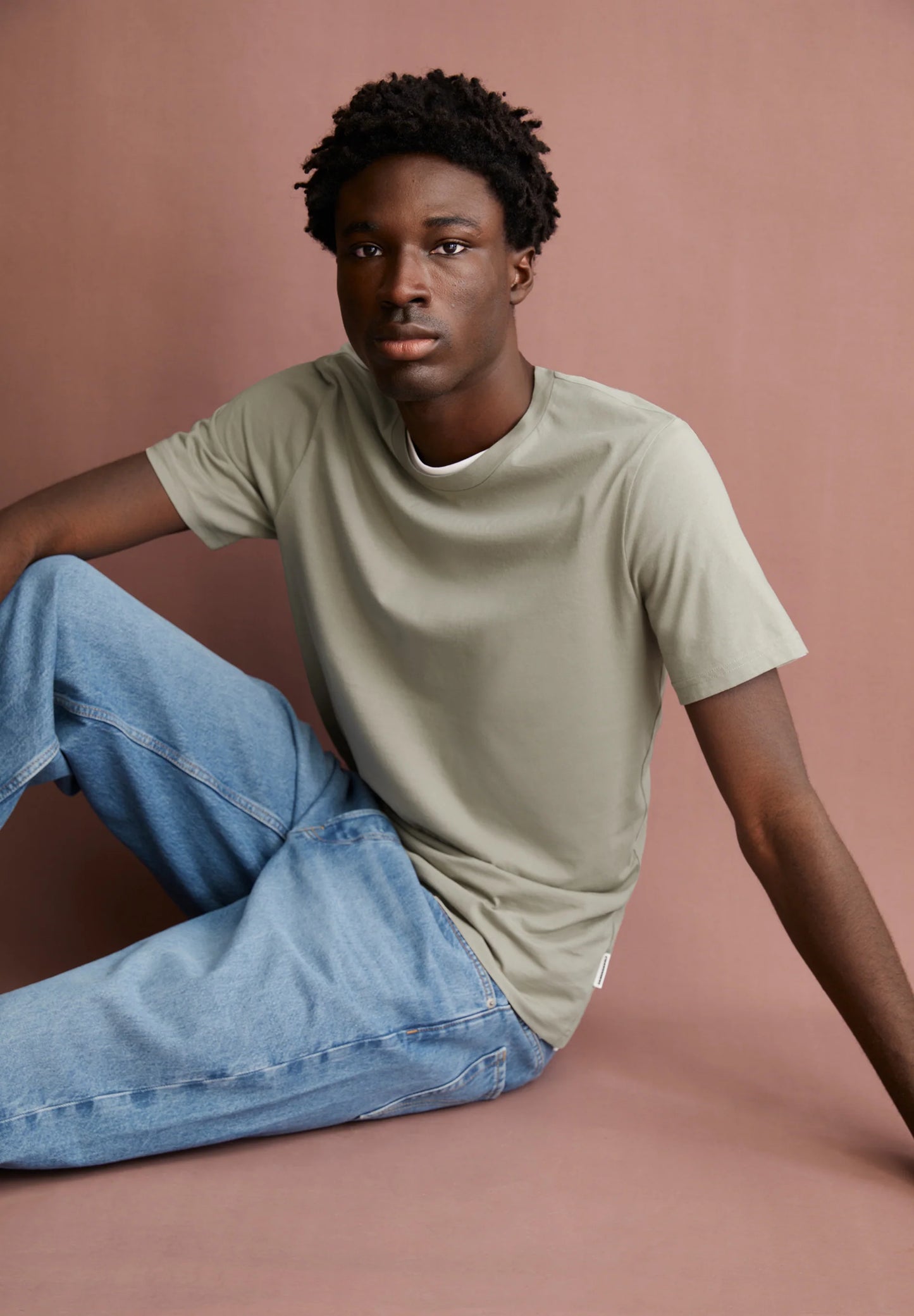Men's ARMEDANGELS Canada organic cotton t-shirt in light green, styled with relaxed jeans for casual wear in Canada