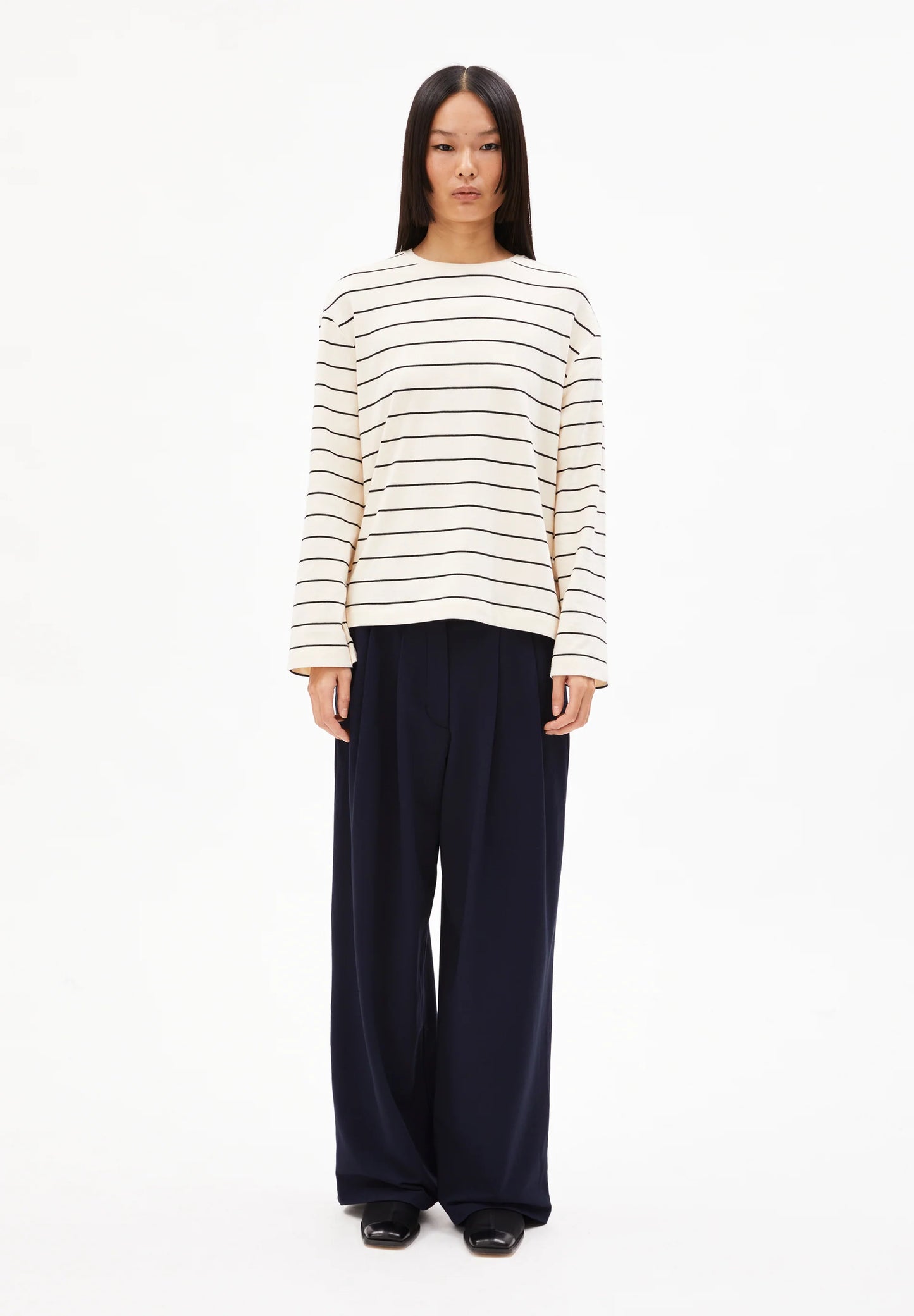 ARMEDANGELS Canada striped shirt in off-white with navy stripes, paired with wide-leg pants in Kelowna and Canada