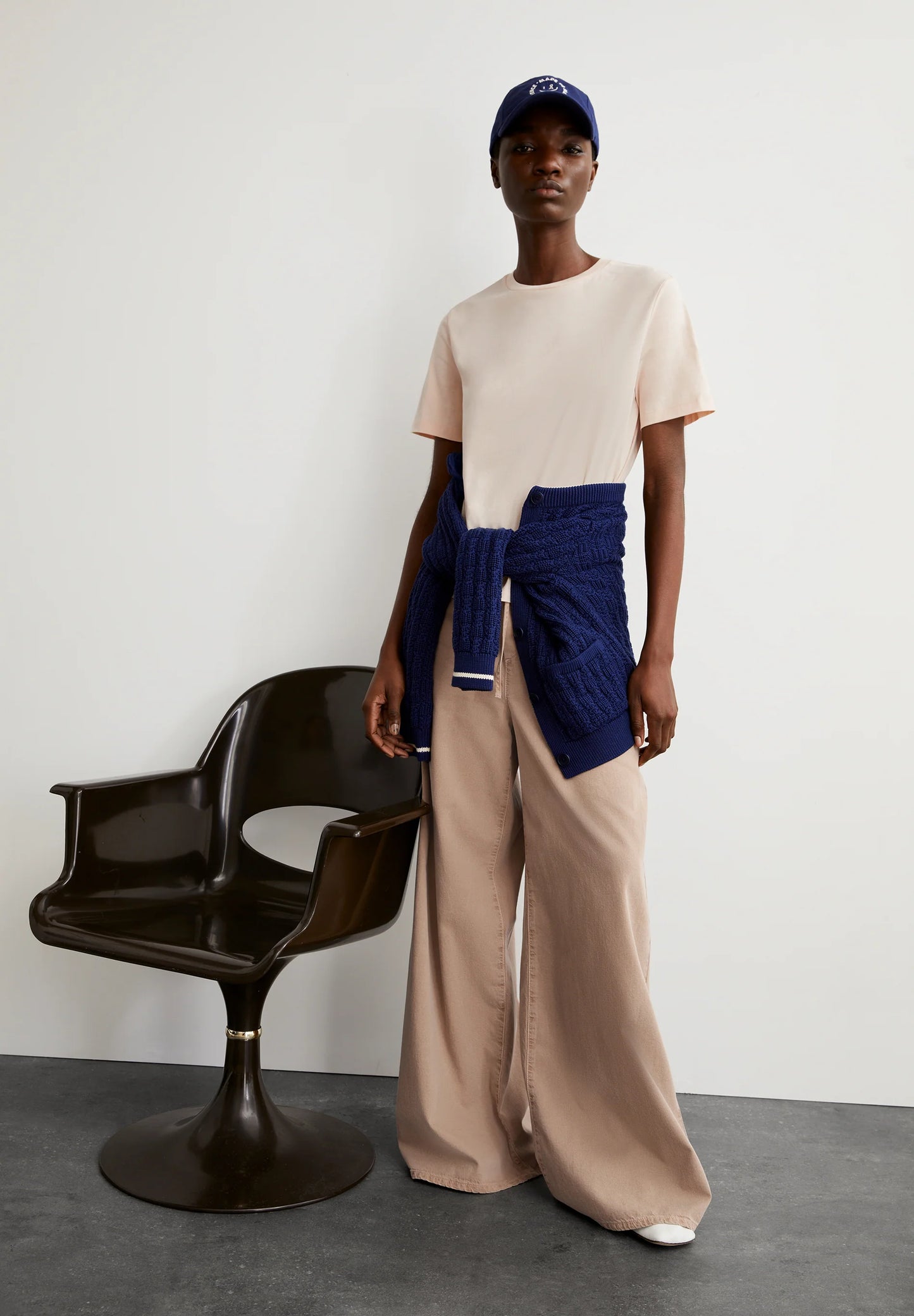 ARMEDANGELS Canada Beige T-Shirt Styled with Wide-Leg Pants and a Navy Sweater for a Casual Look in Canada