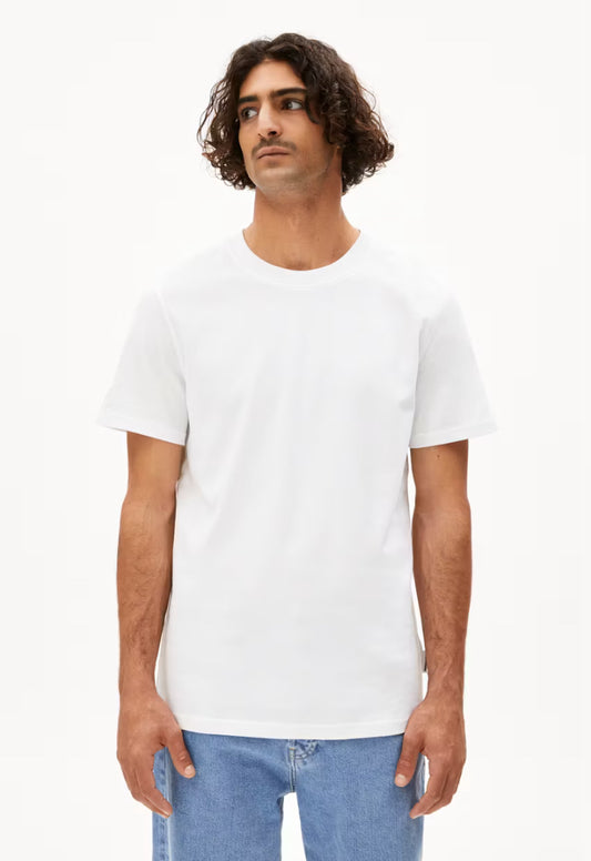 ARMEDANGELS Canada MAARKOS White T-shirt worn by male model with curly hair and blue jeans in Kelowna