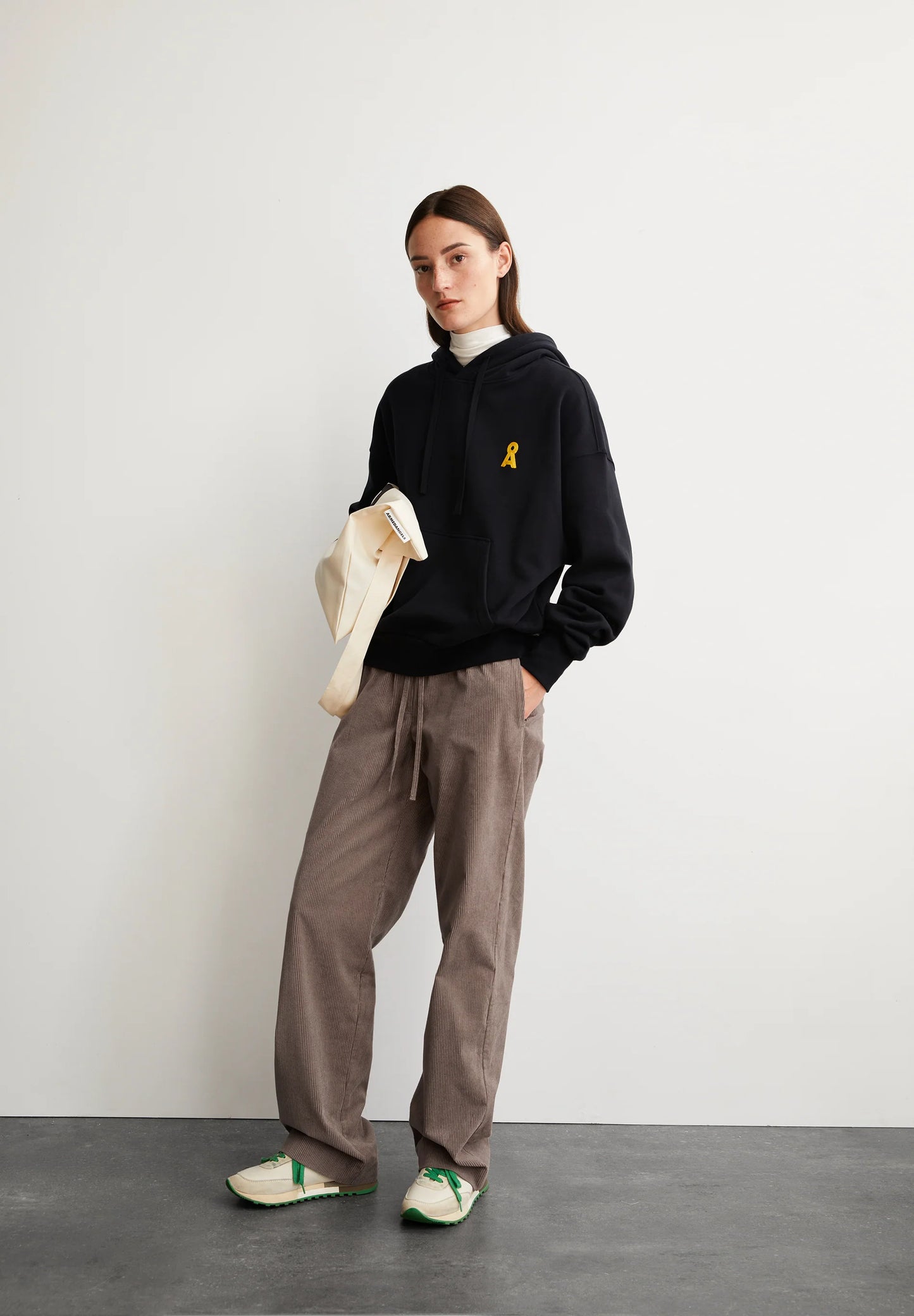 ARMEDANGELS Canada women's corduroy pants in brown with a relaxed fit, styled with a black hoodie in Kelowna