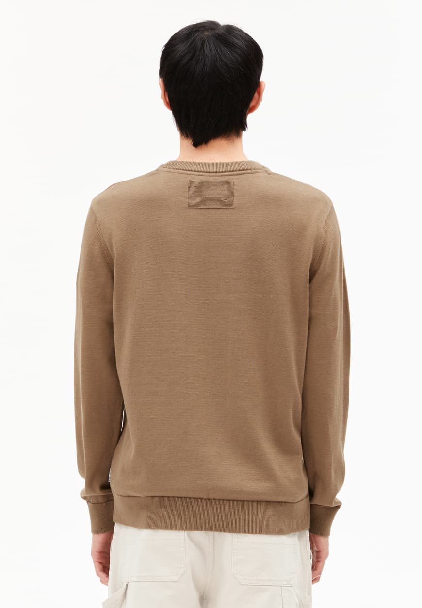 Back view of man wearing ARMEDANGELS Canada men's brown long sleeve sweatshirt with ribbed cuffs in Kelowna