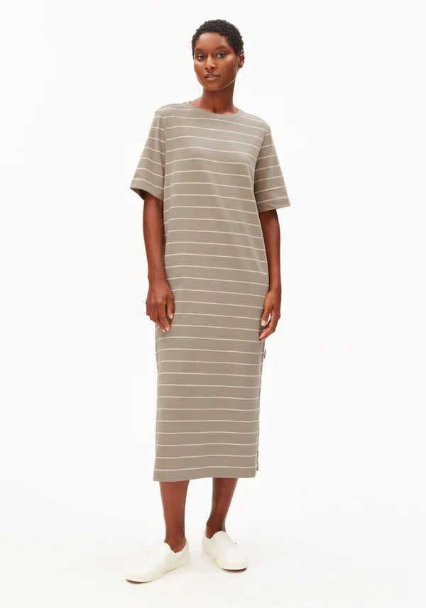 Full shot of model wearing ARMEDANGELS Canada long light brown t-shirt dress with white background