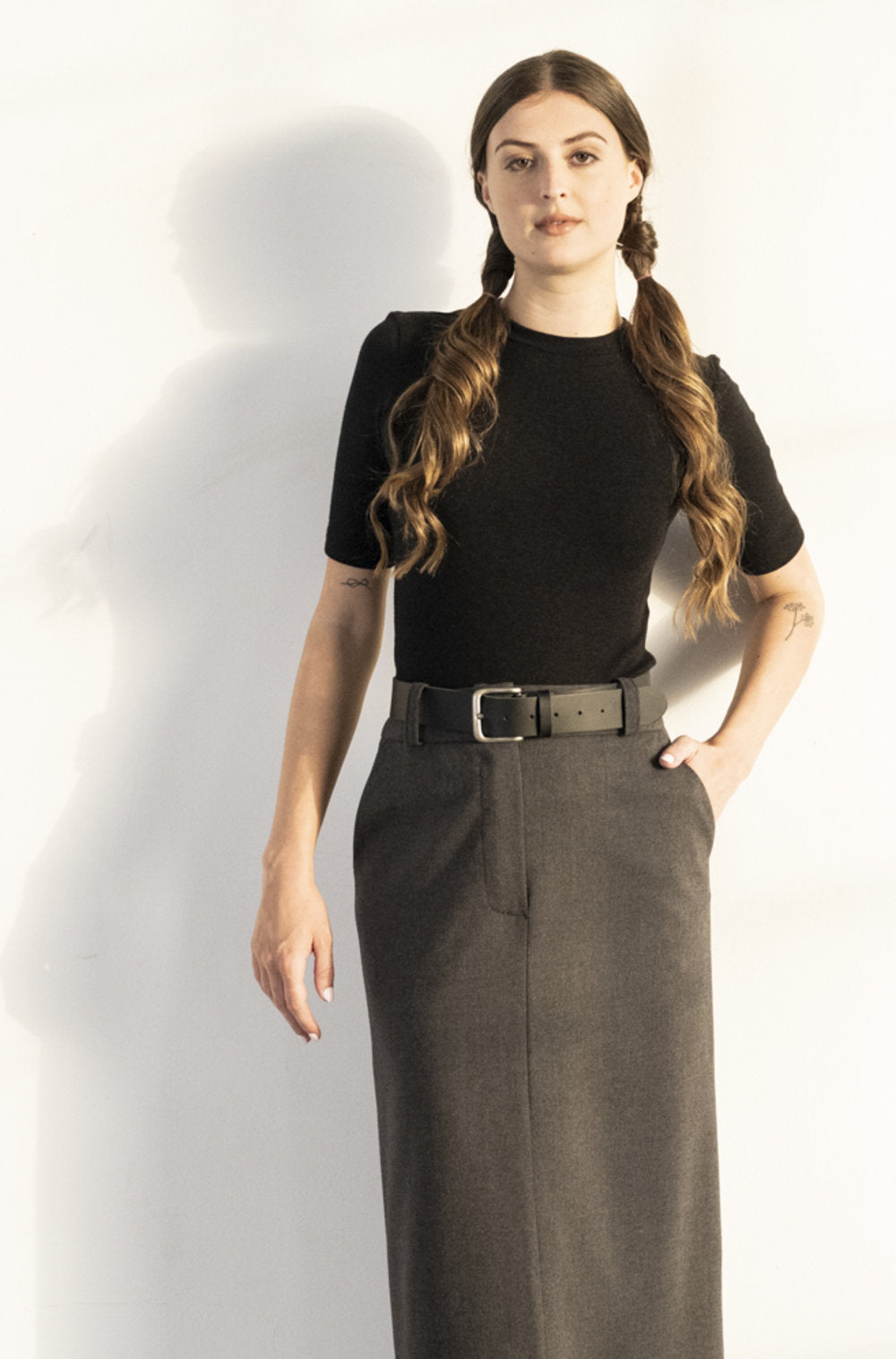 BodyBag by Jude tops and blouses black fitted short sleeve top tucked into gray high waisted skirt in Kelowna
