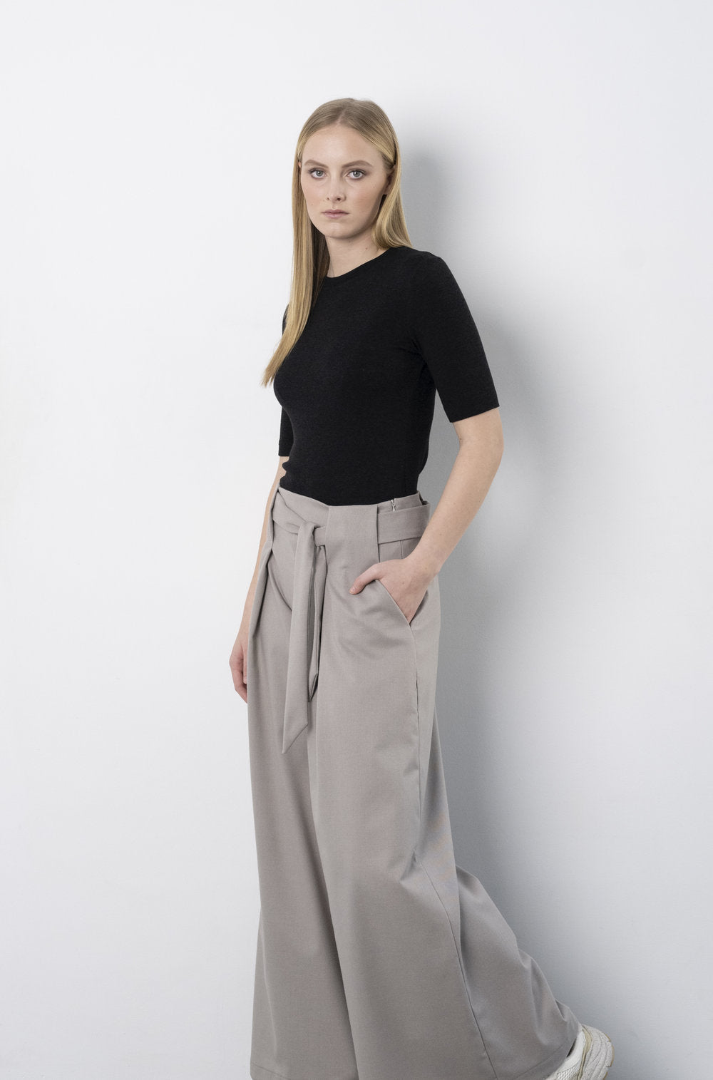BodyBag by Jude black fitted short sleeve top from tops and blouses collection styled with high waisted trousers in Kelowna
