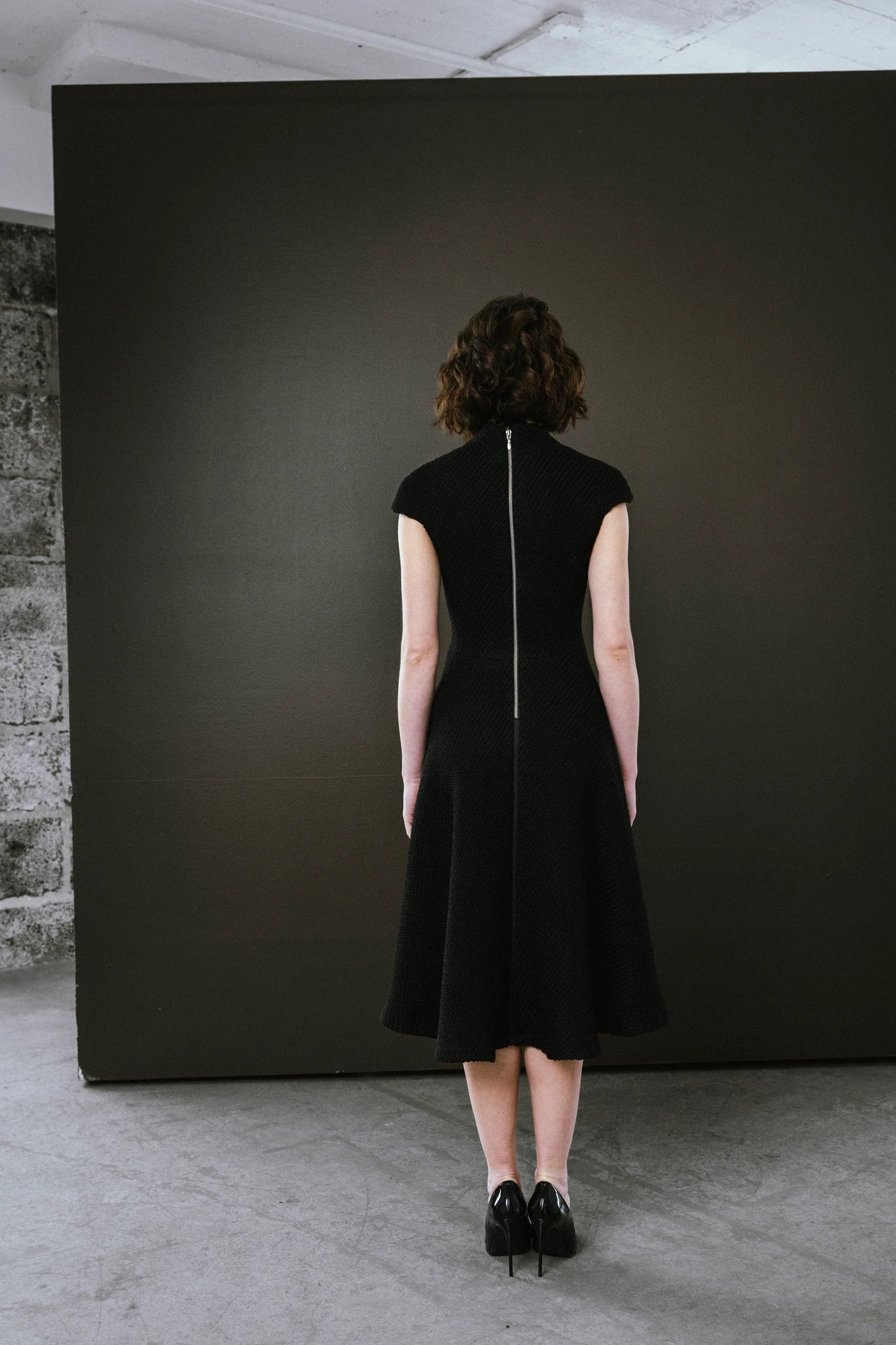 Elegant black dress by BodyBag by Jude with a fitted silhouette and zip closure at the back in Kelowna