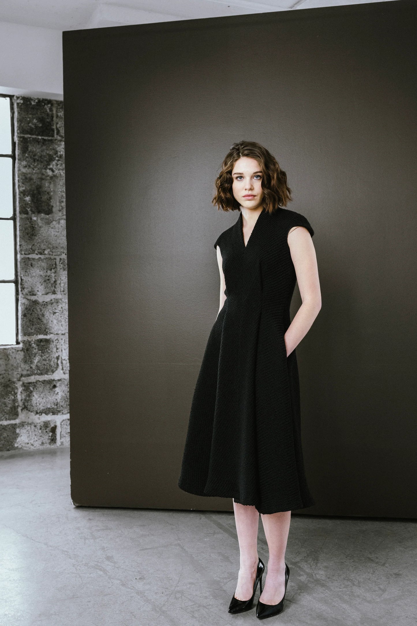 Bodybag by Jude Elegant black dress by BodyBag by Jude, featuring a fitted bodice and flared skirt with pockets in Kelowna