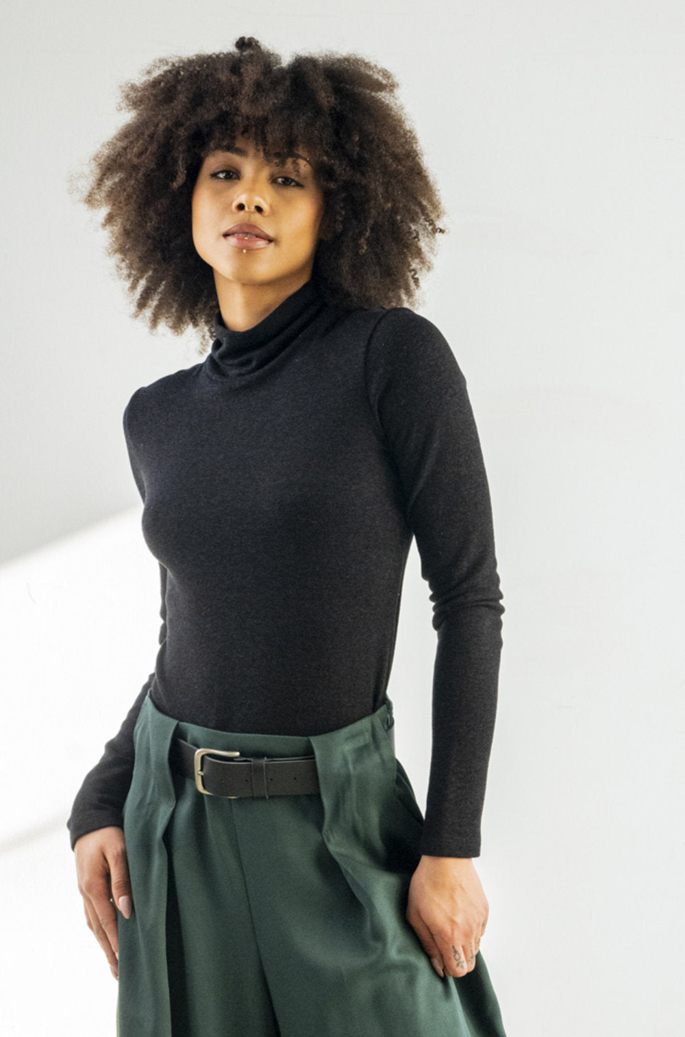 BodyBag by Jude fitted black turtleneck top on model with long sleeves Tops and Blouses in Kelowna
