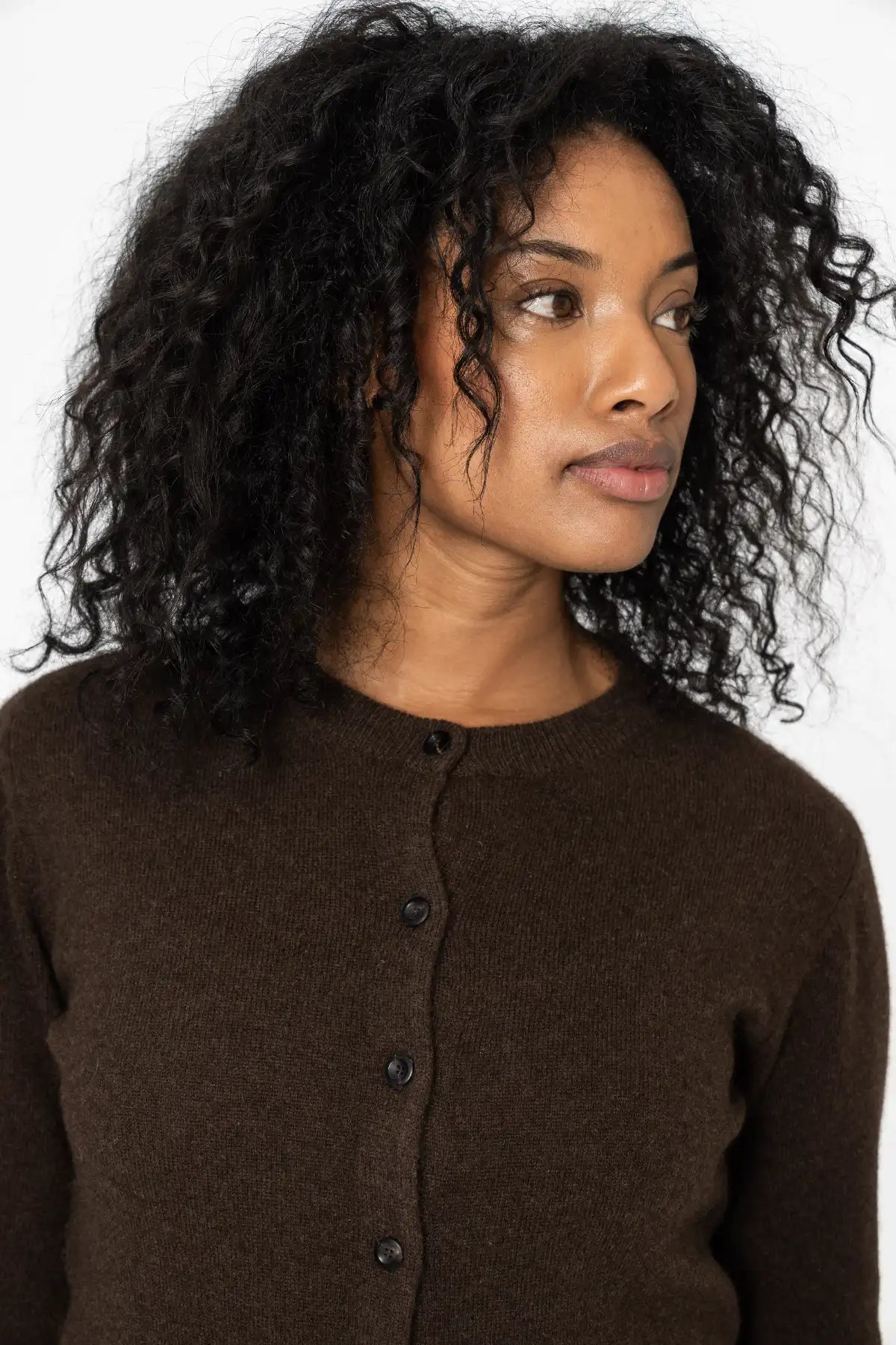 Stylish dark brown cardigan from Dinadi, featuring a button-up front and soft fabric in Kelowna and Canada