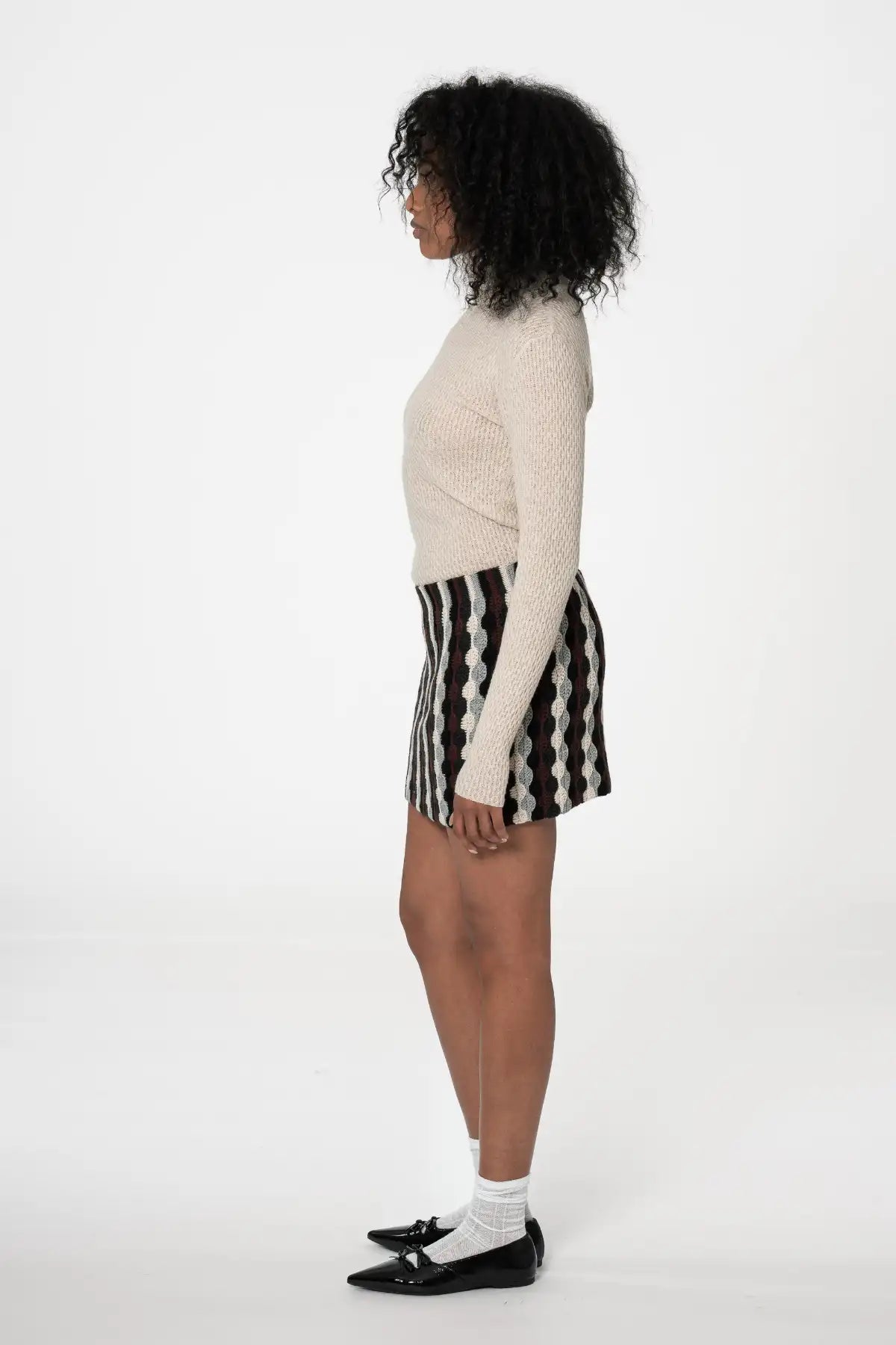 Dinadi merino turtleneck sweater in beige, perfect for layering with skirts and pants in Kelowna and Canada