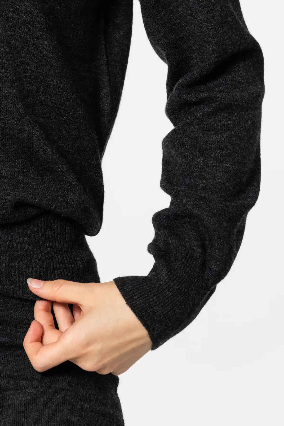 Black Dinadi women's merino wool sweater featuring a soft knit and fitted sleeves for warmth and comfort in Kelowna and Canada