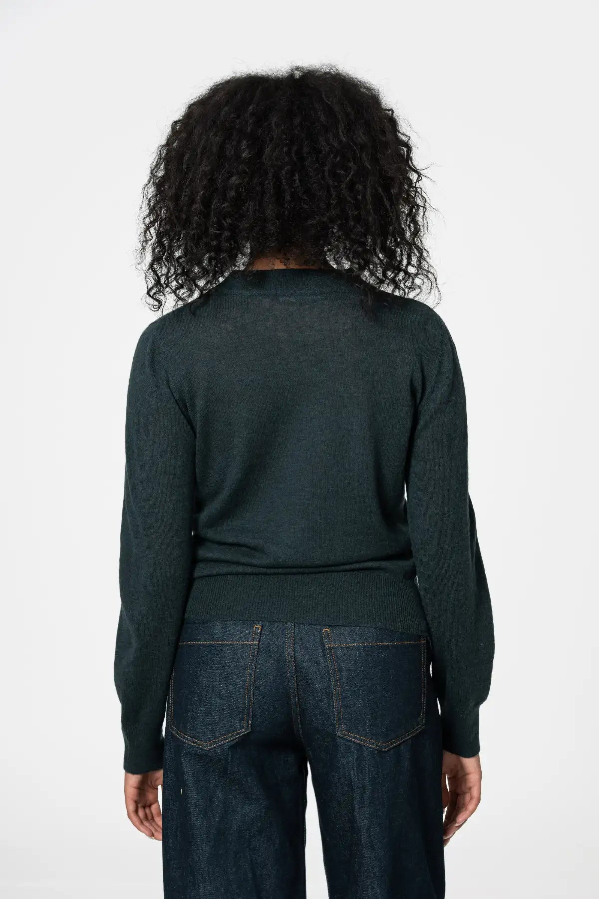 Dinadi womens merino wool sweater in dark green, featuring a fitted design and soft texture in Kelowna and Canada