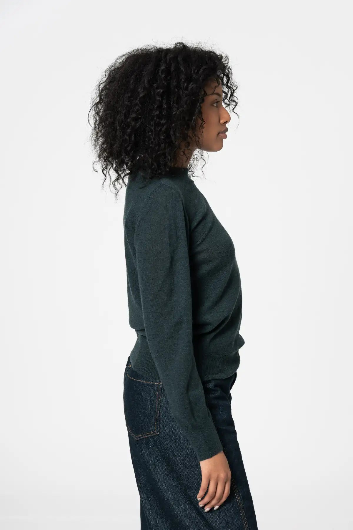 Dinadi womens merino wool sweater in dark green perfect for layering and versatile styling in Kelowna and Canada