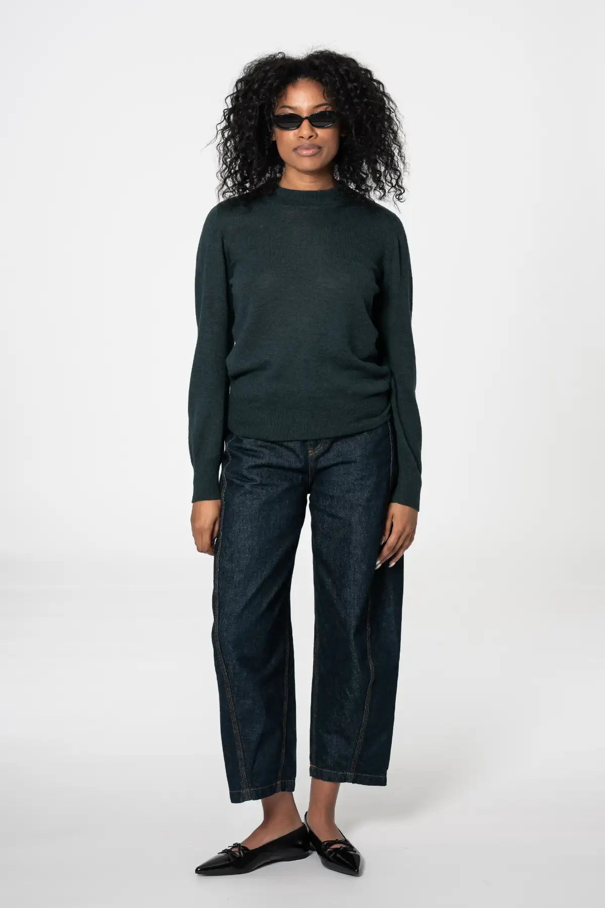 Dinadi womens merino wool sweater in dark green paired with high-waisted jeans for a stylish look in Kelowna and Canada