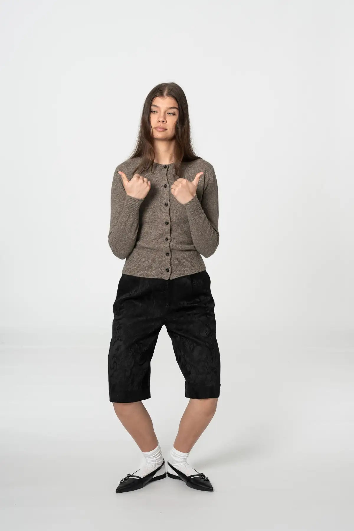 Dinadi stylish brown cardigan with button closure, worn with black shorts and stylish shoes in Kelowna and Canada