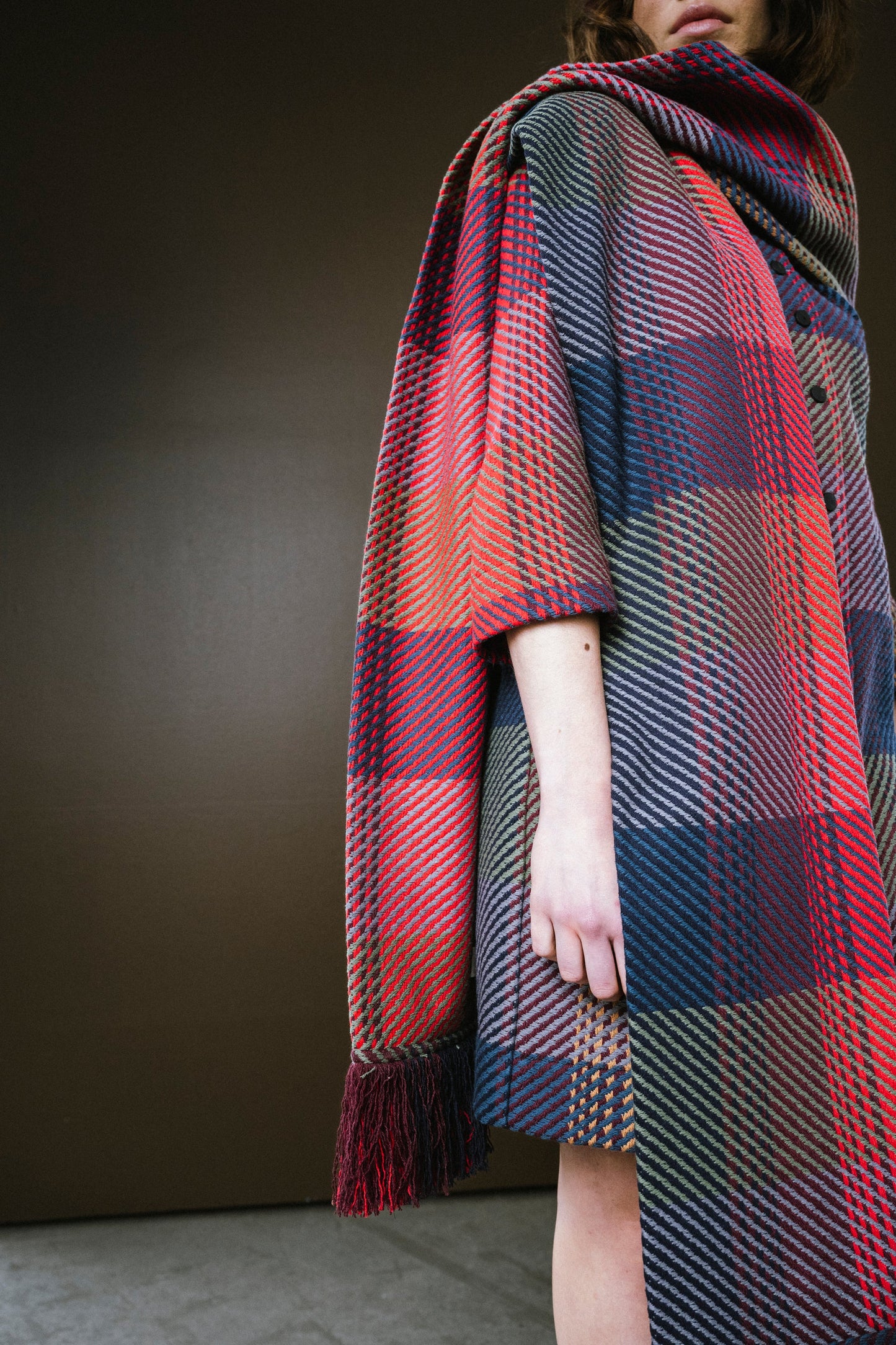 Cozy plaid scarf by BodyBag by Jude with vibrant colors and fringed edges, perfect for stylish layering