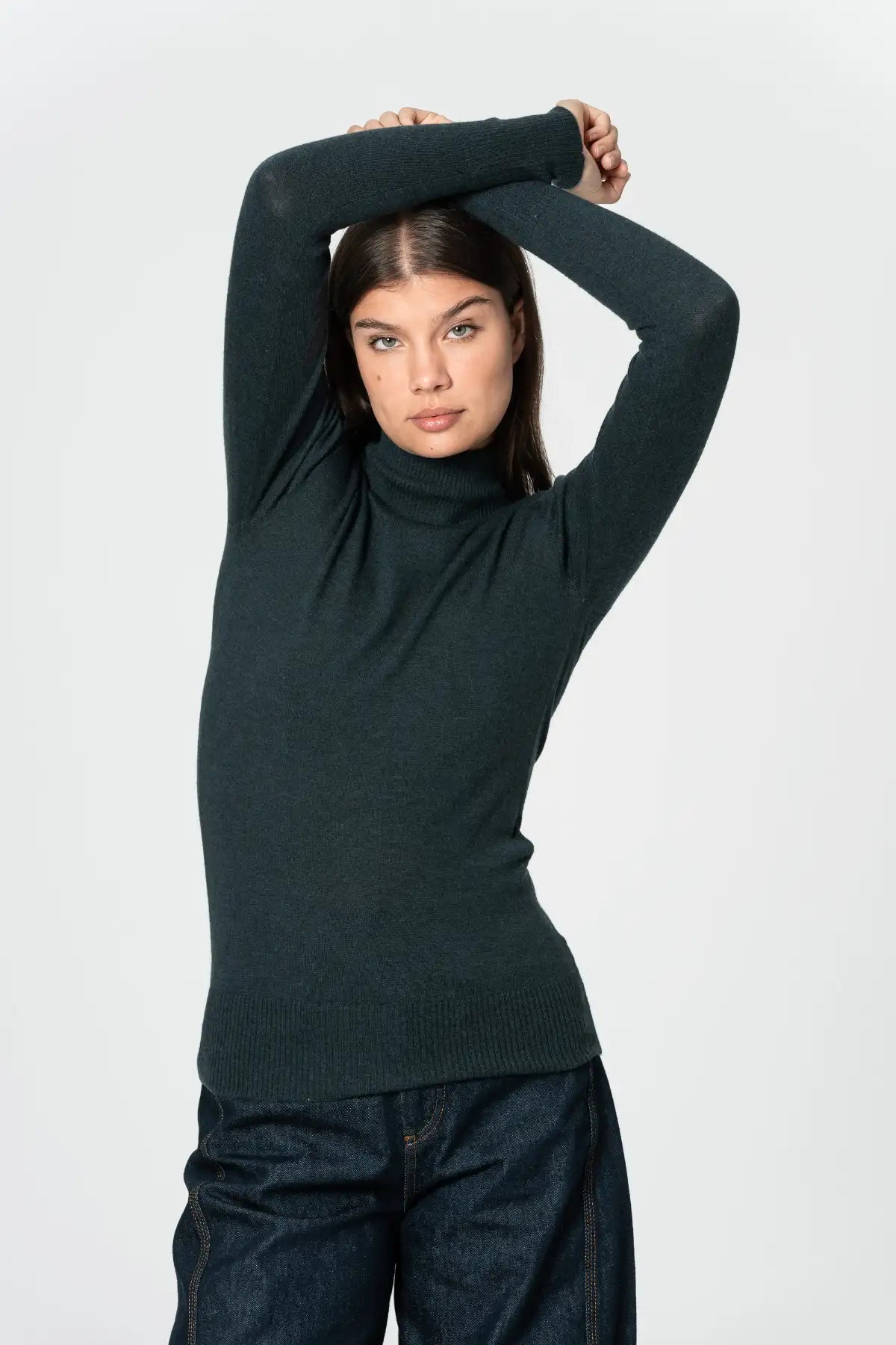 Dinadi women's merino turtleneck sweater in dark green with fitted design and long sleeves