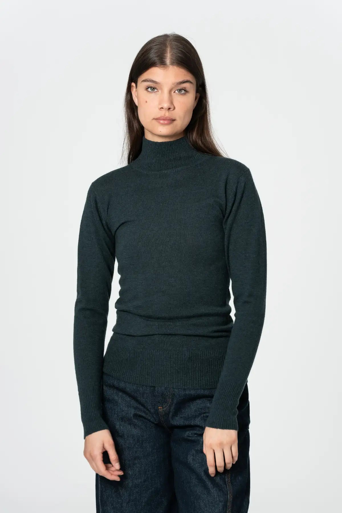 Dinadi women's merino turtleneck sweater in dark green, perfect for layering in cooler weather
