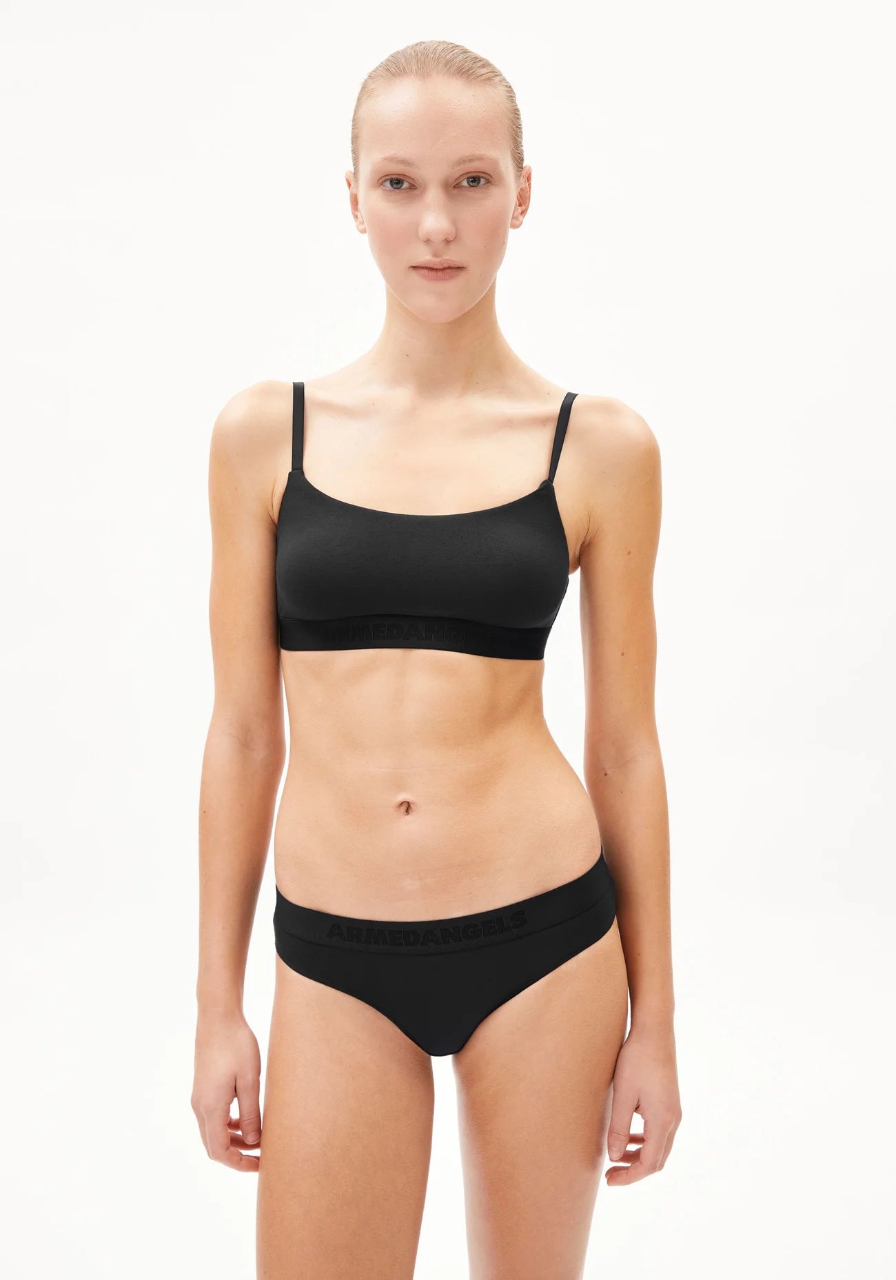 TOVAA Bralette - ARMEDANGELS Canada black natural fabric bra on model front view in Kelowna