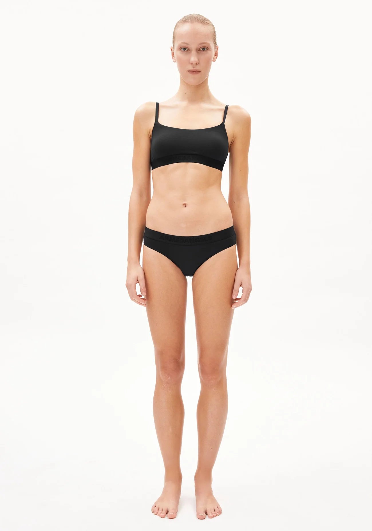 TOVAA Bralette - ARMEDANGELS Canada black bra made from natural fabric on model front view in Kelowna