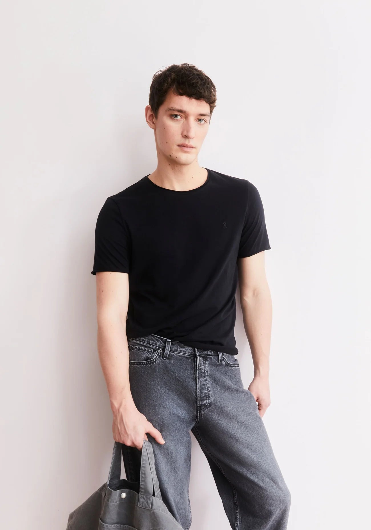 Men's black t-shirt organic cotton JAAMES BRUSHED T-SHIRT in Black - ARMEDANGELS Canada styled view with black denim in Kelowna