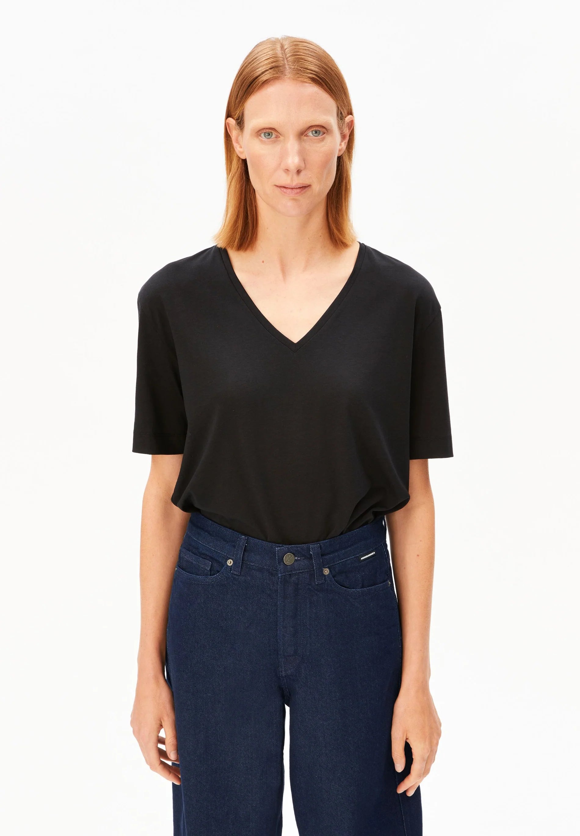 V-Neck T-Shirt – ARMEDANGELS Canada in black front view on model
