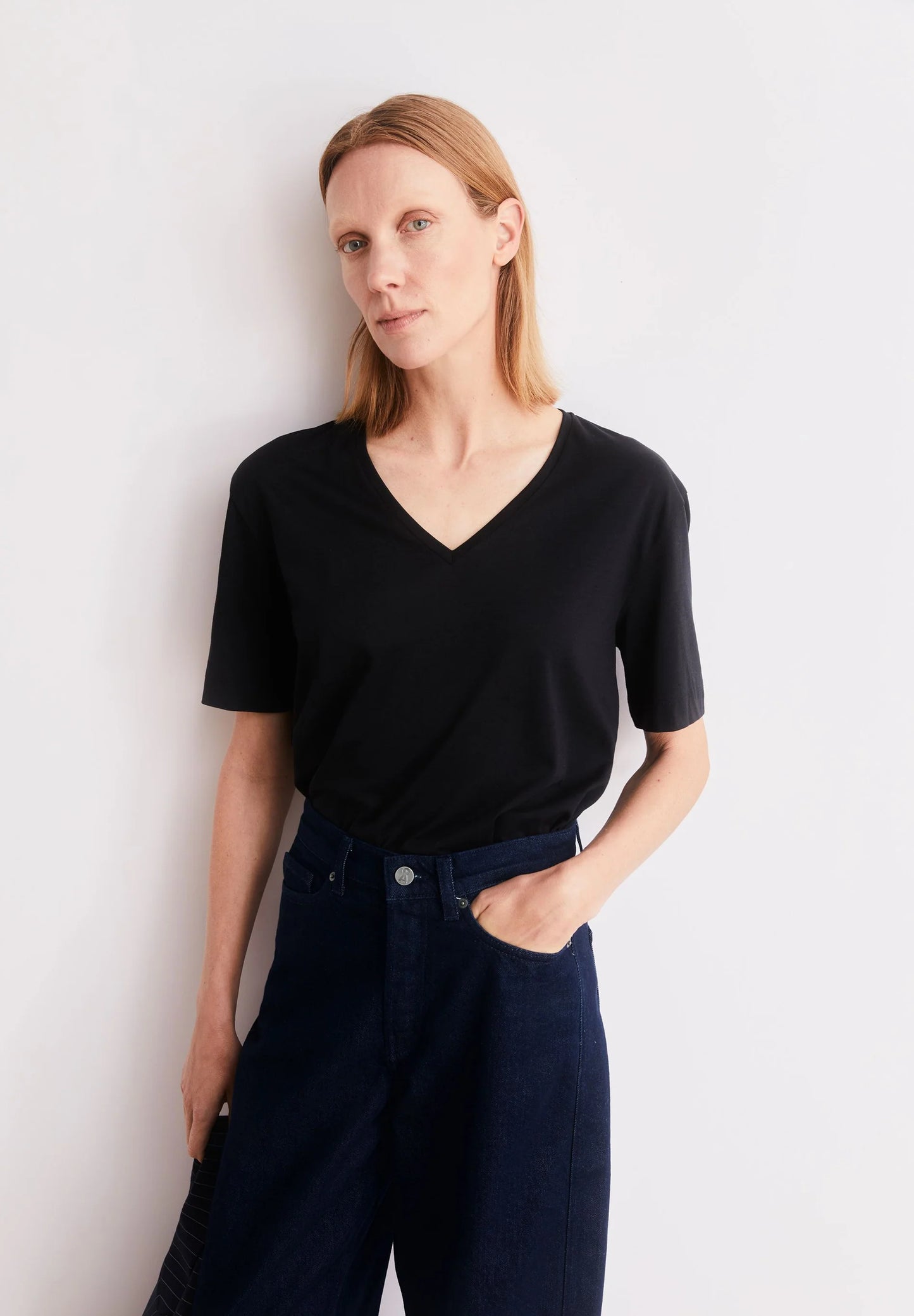 styled photo of black t-shirt V-Neck T-Shirt – ARMEDANGELS Canada in Kelowna
