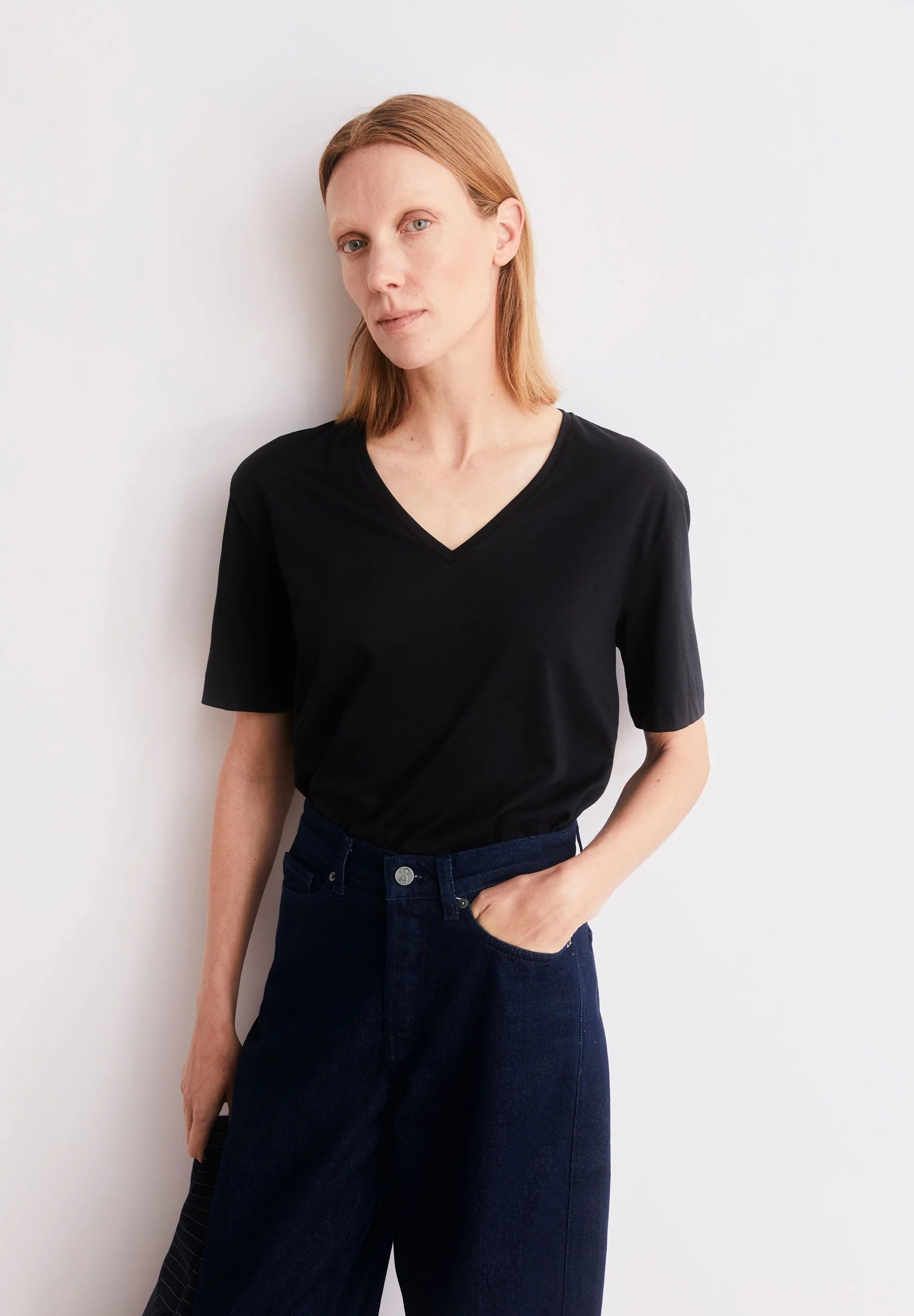 styled photo of black t-shirt V-Neck T-Shirt – ARMEDANGELS Canada in Kelowna