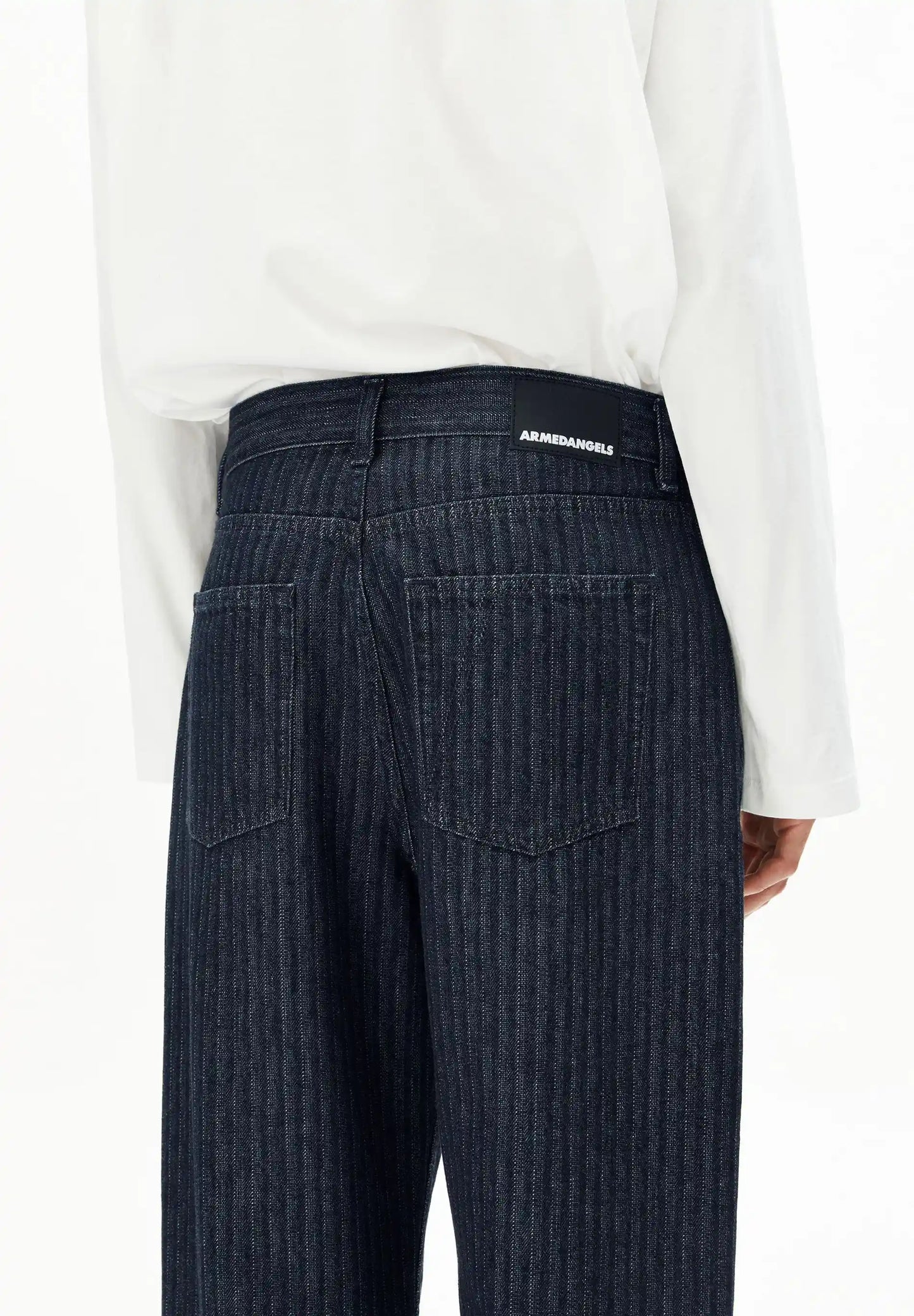ARMEDANGELS Canada – HAAYI Herringbone Baggy Jean in Rinse back detail view on model in Kelowna
