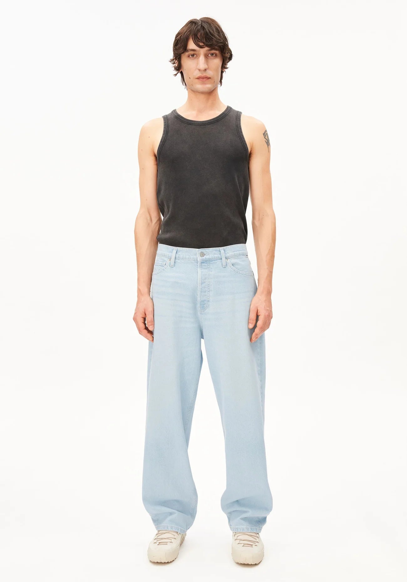 GMT DYE TANK TOP in Black-wash - ARMEDANGELS Canada garment dye black men's tank top on model front view