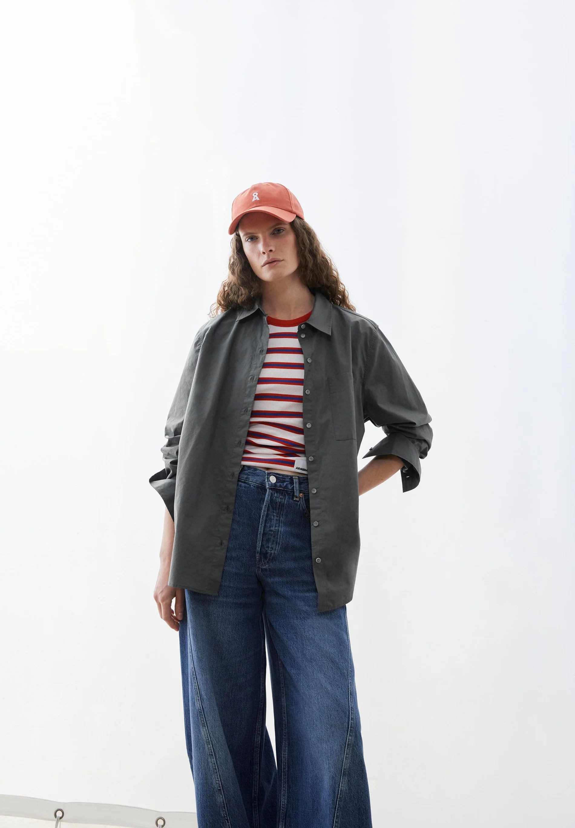 LOOSE POPLIN SHIRT BLOUSE in Space Steel - ARMEDANGELS Canada. Oversized grey button up shirt styled with a white and red striped t-shirt and denim in Kelowna