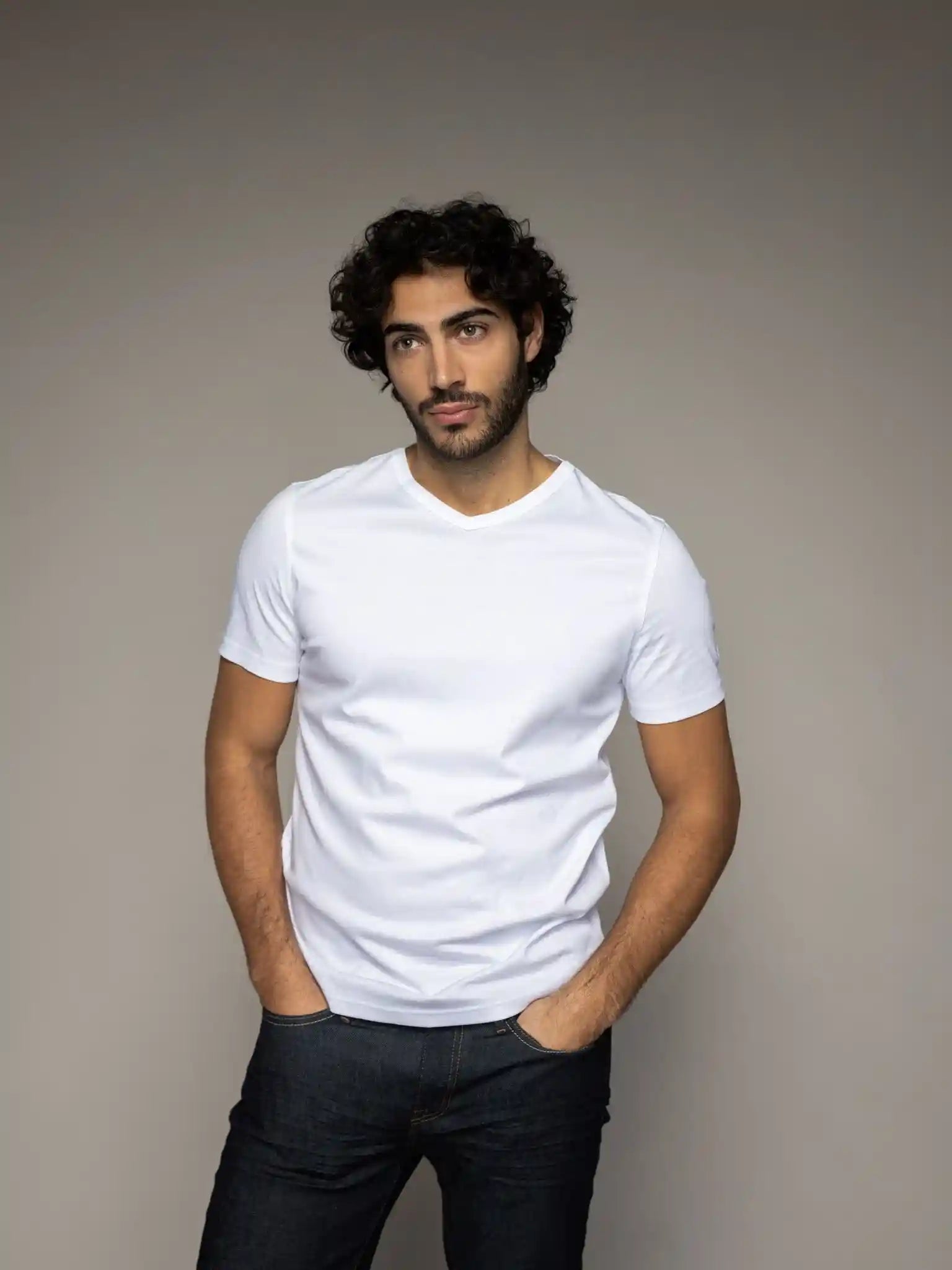 Mos Mosh Gallery V-neck tee in white on model front view at Textile Apparel Kelownam ade from organic cotton