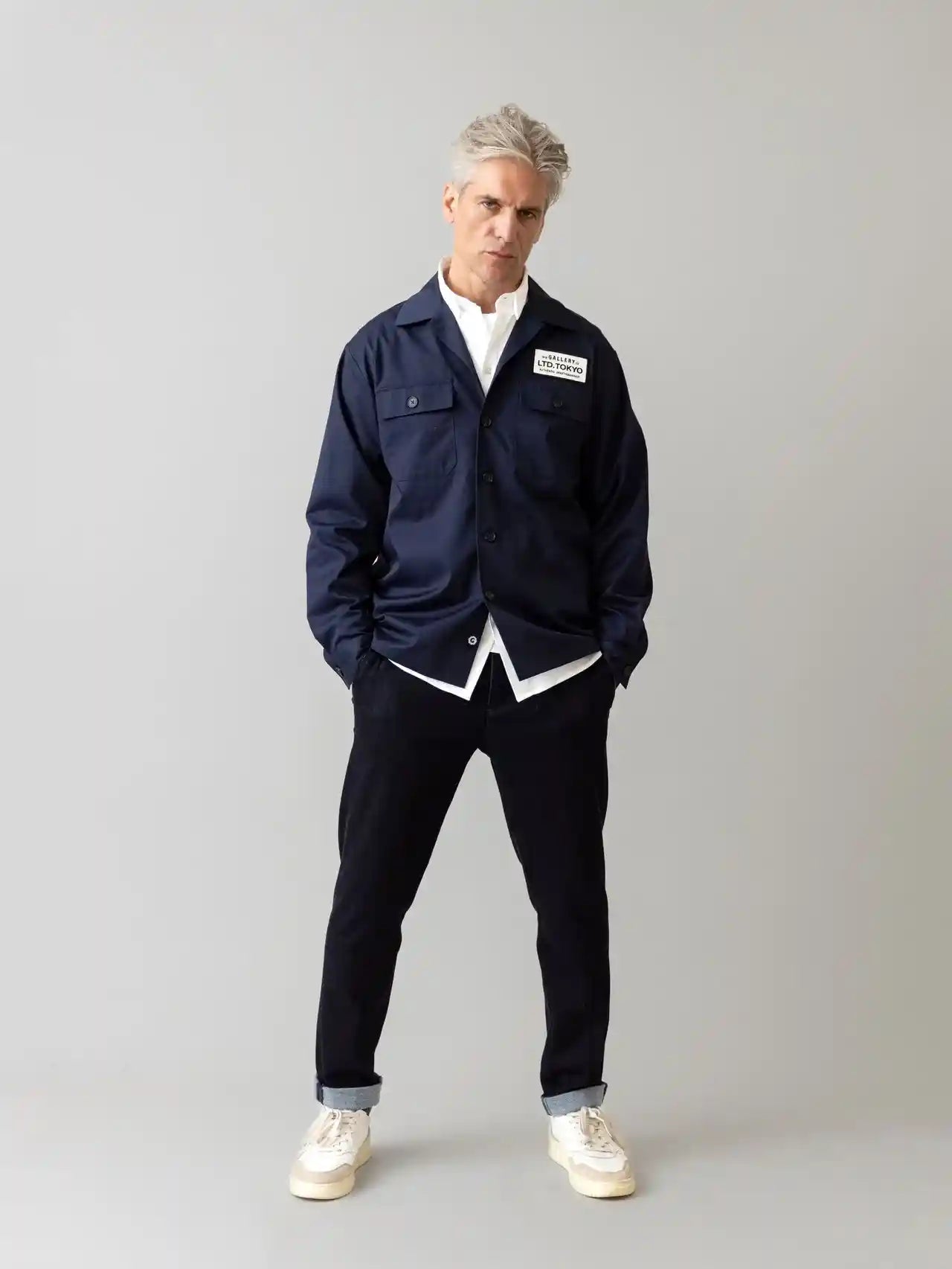 mos mosh gallery dark blue comfy pants on model wearing a blue jacket in kelowna