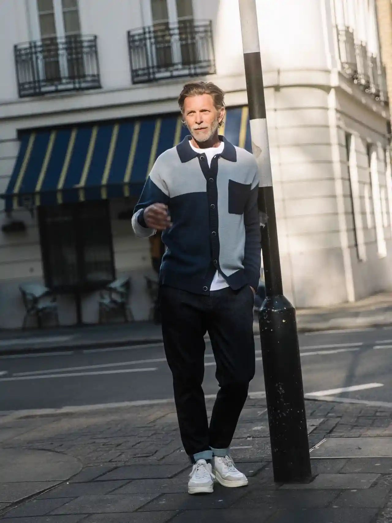 man outside on a street wearing mos mosh gallery hunt comfy pant in dark blue from textile apparel kelowna