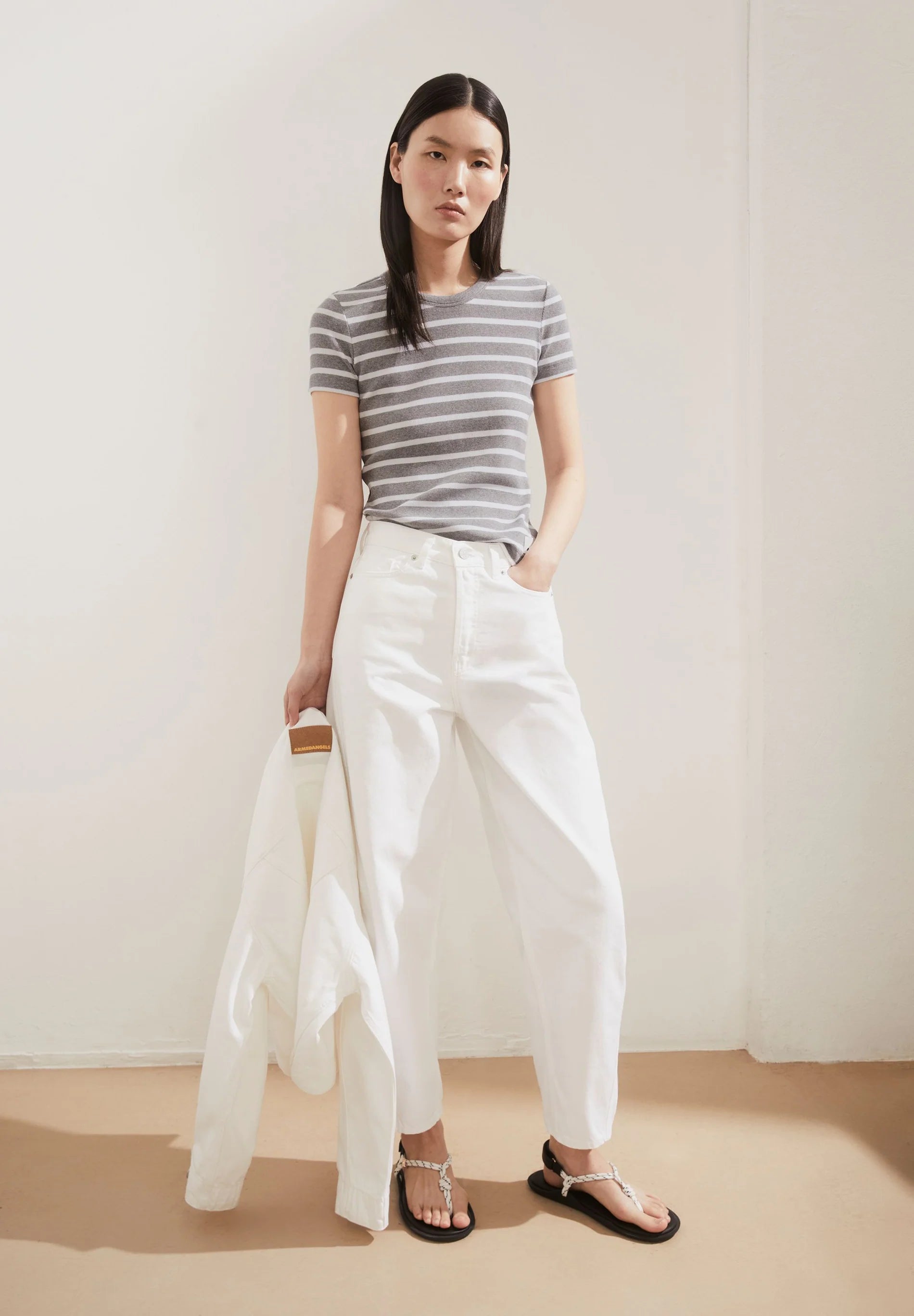 women's ARMEDANGELS KARDAA Ribbed Stripes T-Shirt, front shot with white pants and jacket on model, organic cotton in Kelowna