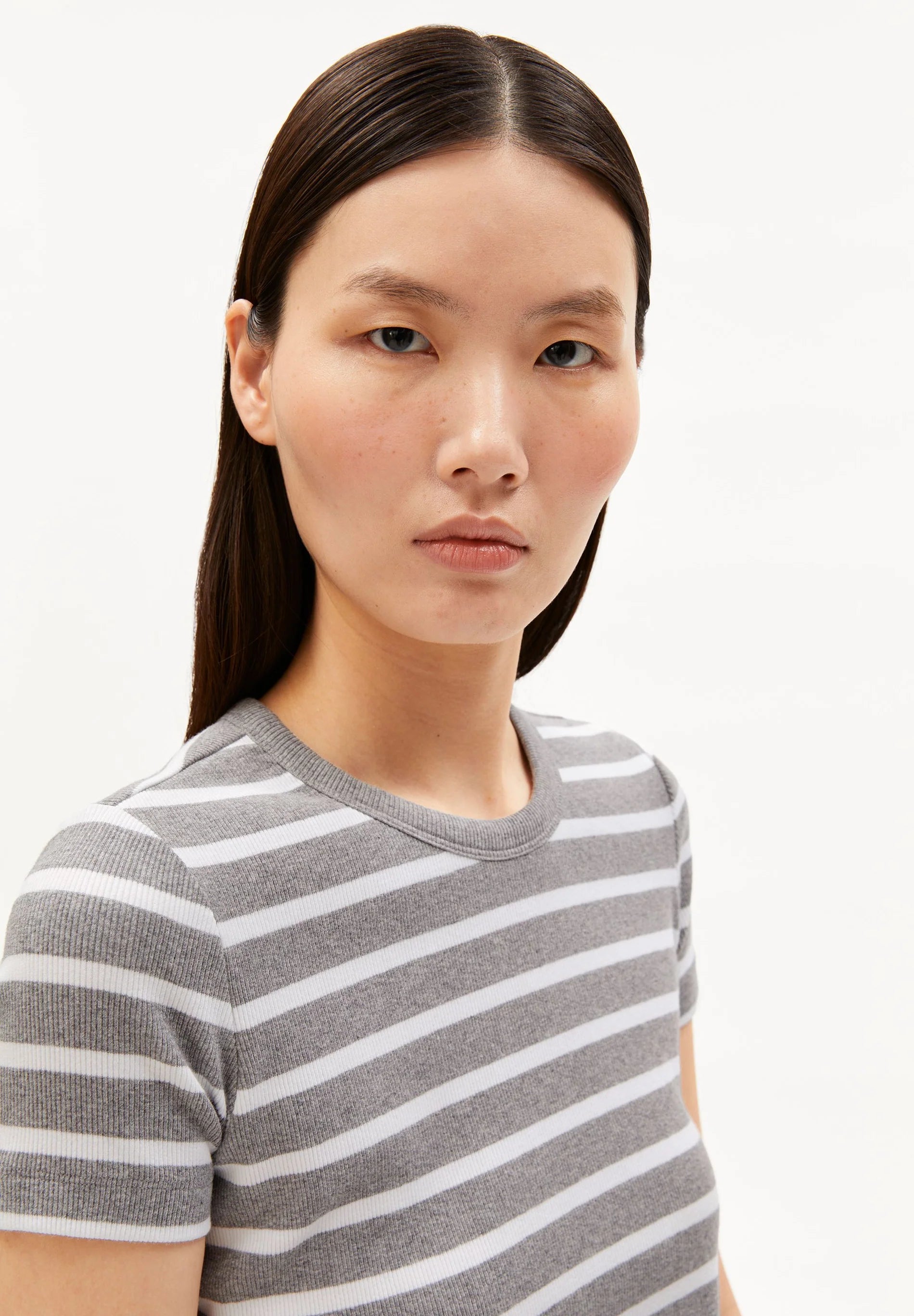 close up on model of women's ARMEDANGELS KARDAA Ribbed Stripes T-Shirt, organic cotton