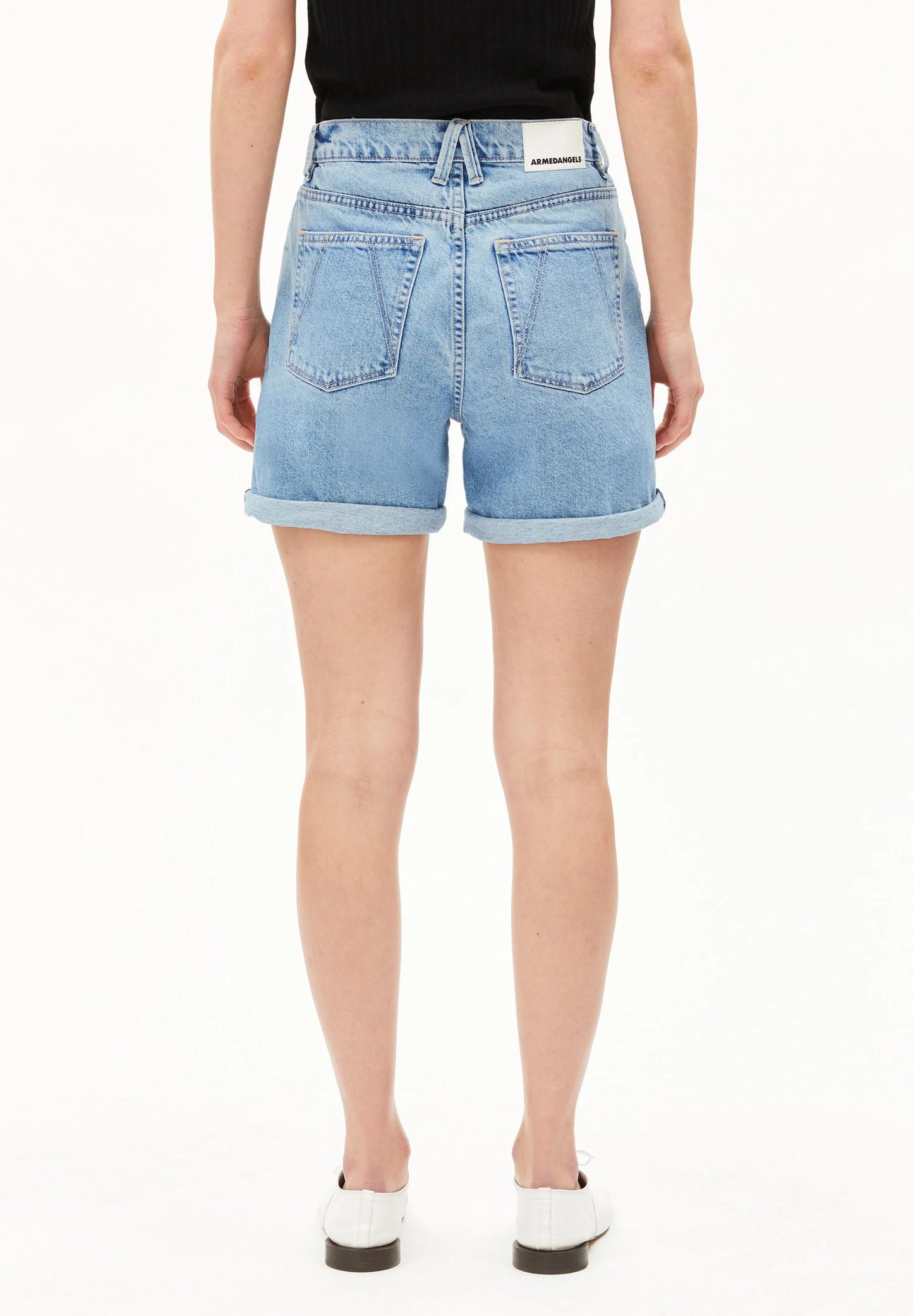 Person wearing light blue denim shorts on a white background for Kelowna and Canada