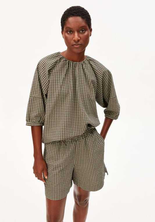 Model in green and brown check cotton shirt and shorts for Kelowna and Canada