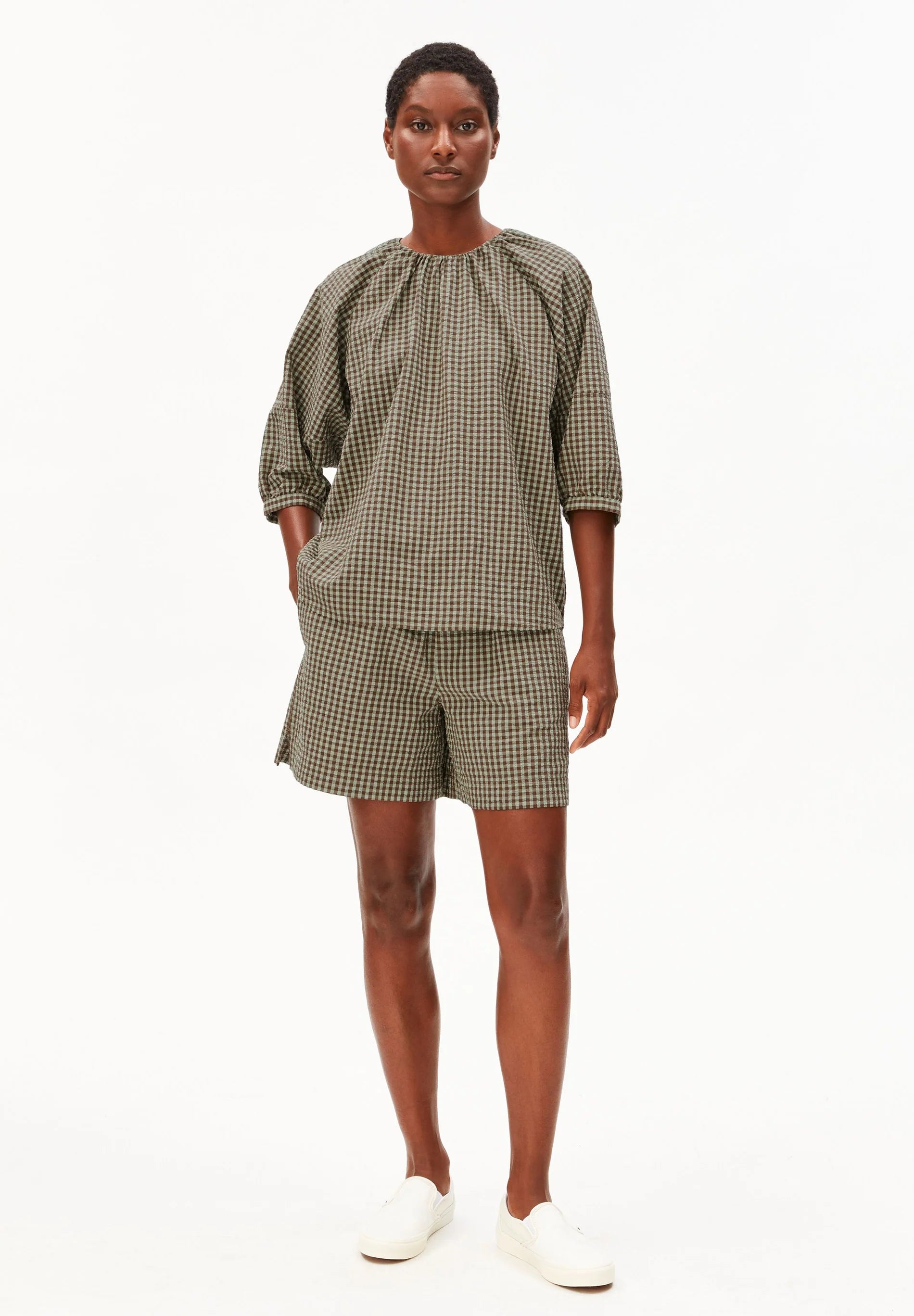 Full model shot in green and brown check cotton shirt and shorts for Kelowna and Canada