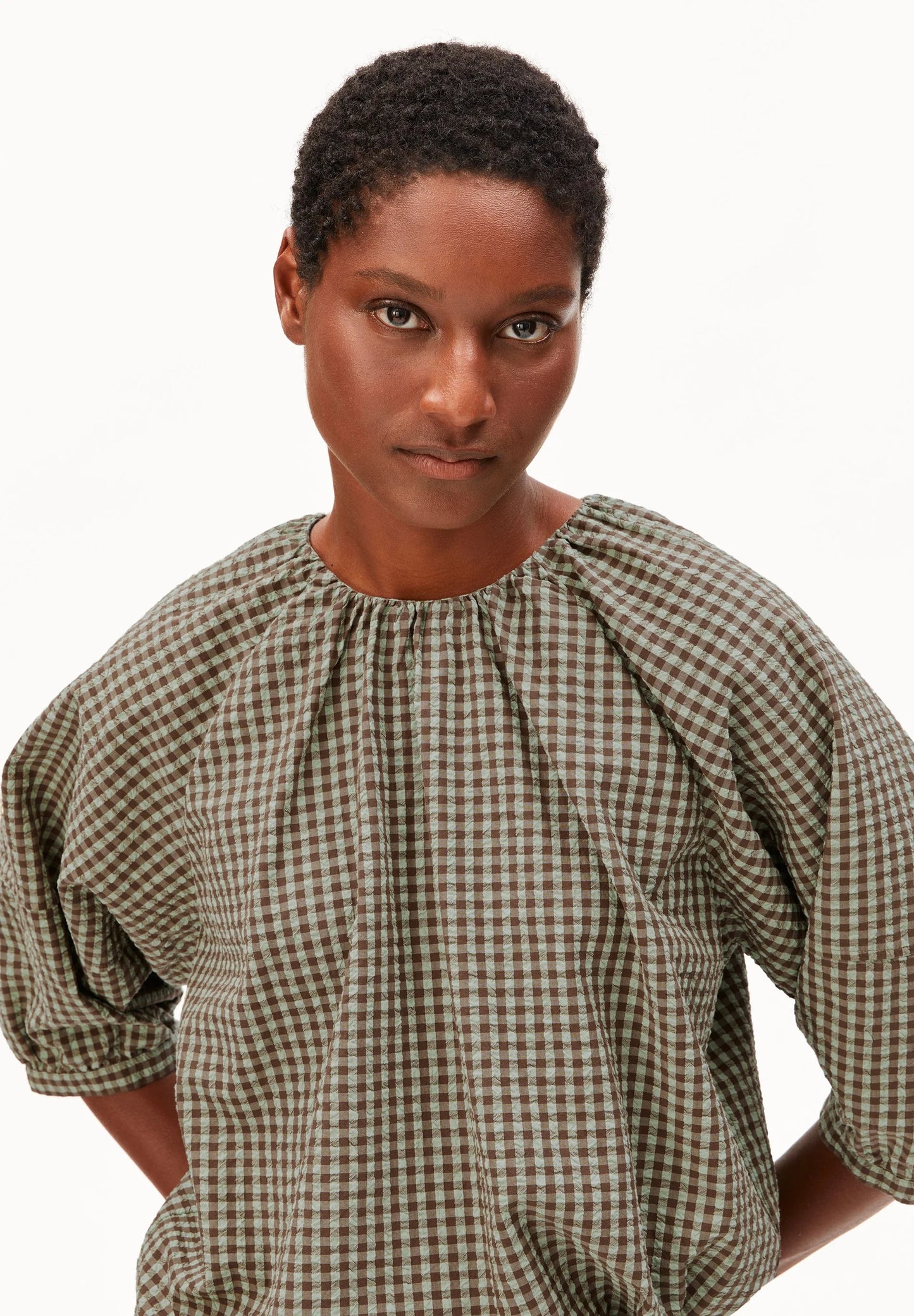 Head shot of model in green and brown check cotton shirt and shorts for Kelowna and Canada