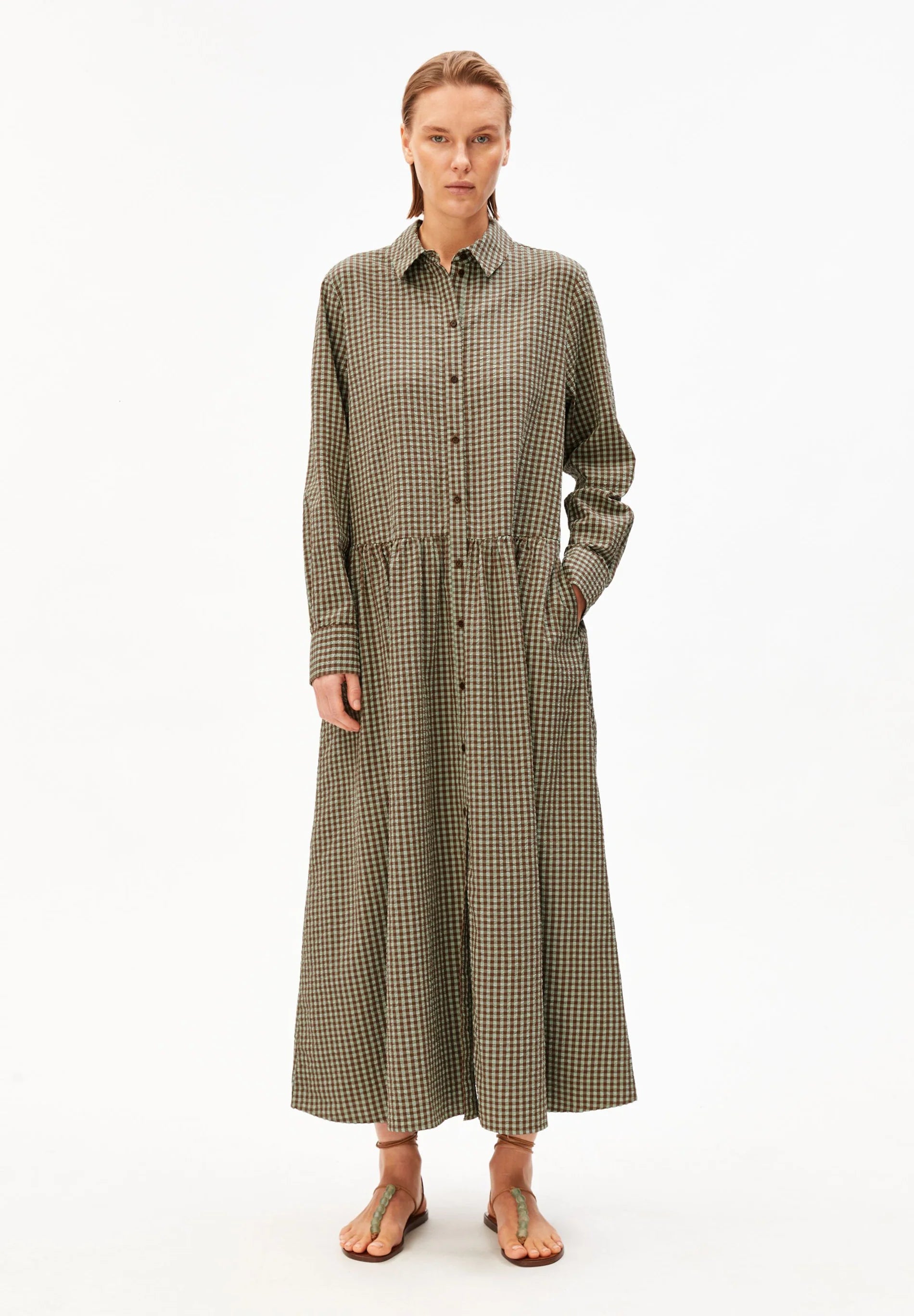 Full length model shot in green and brown check dress for Kelowna and Canada