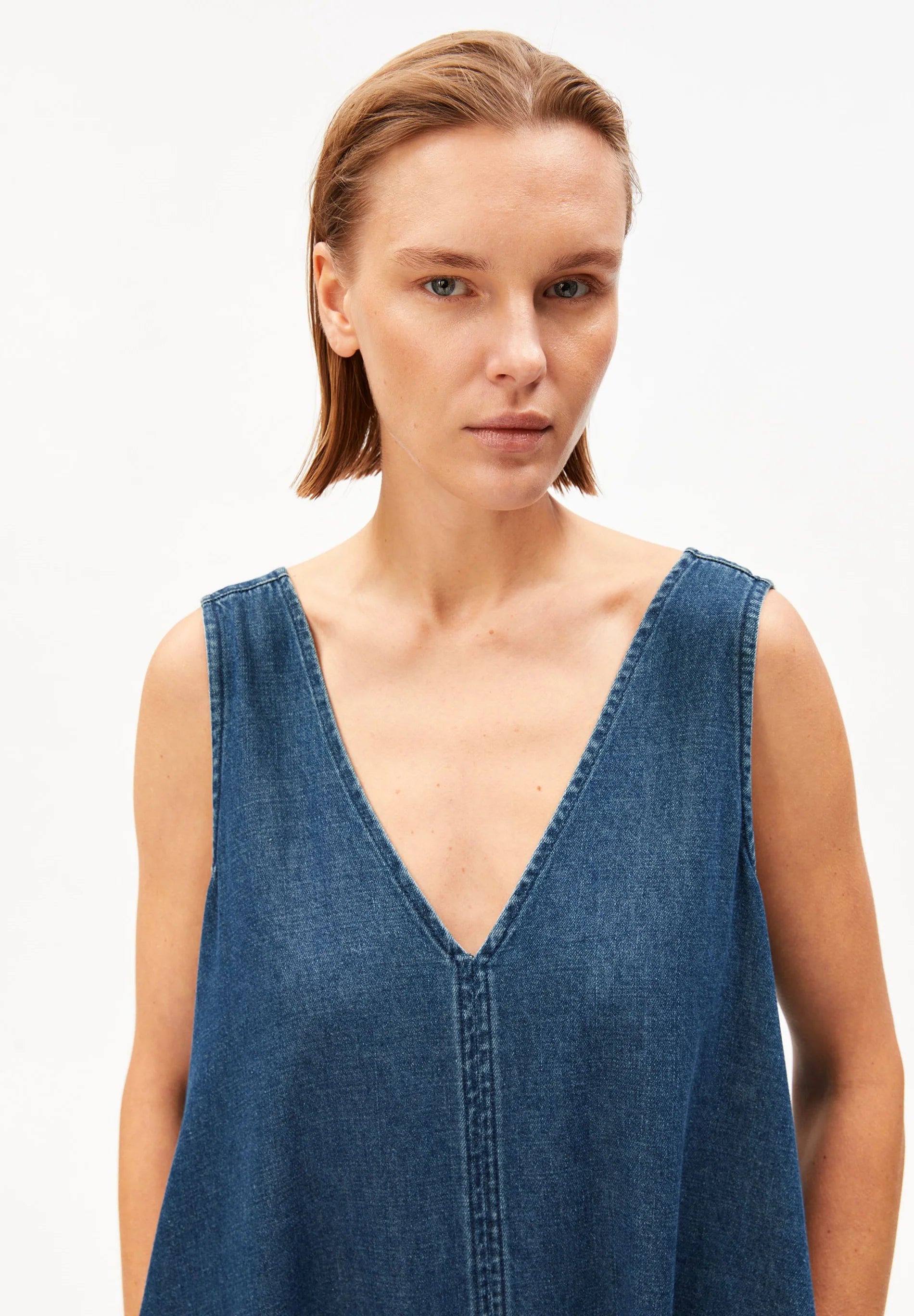 women's ARMEDANGELS Canada Denim V-Neck Midi Dress in Eau, full model front view closeup in Kelowna