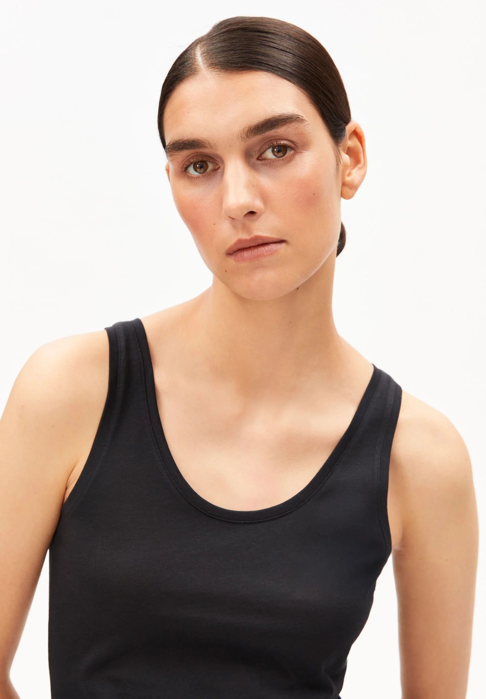 women's ARMEDANGELS Canada Single Jersey Top in Black, front close-up view on model in Kelowna