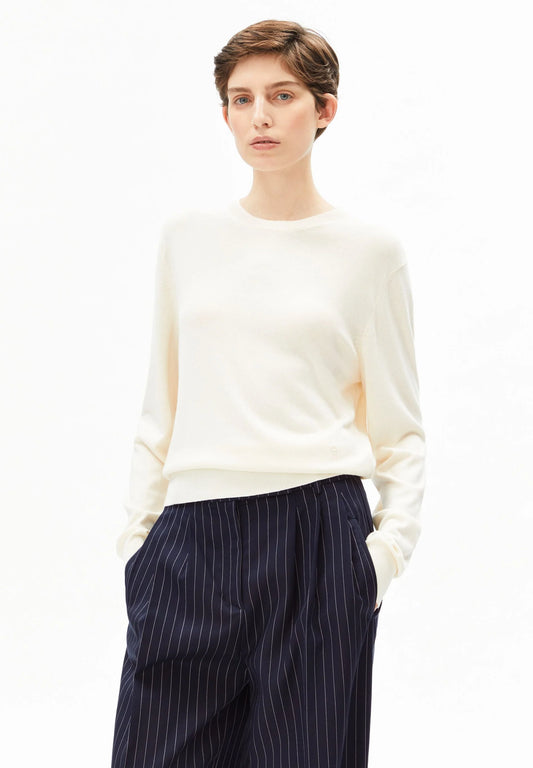 Woman wearing oatmilk fine knit sweater with short sleeves - ARMEDANGELS organic cotton sustainable knitwear Canada