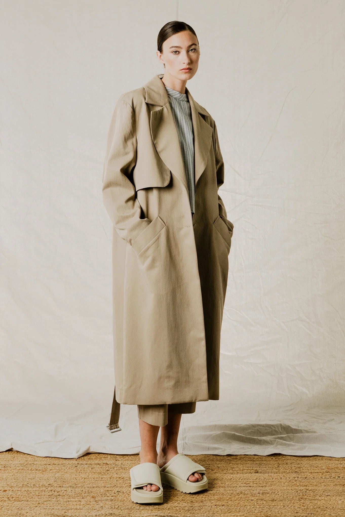 front relaxed view of District Trench Coat in Beige by Bodybag by Jude — oversized Tencel-cotton trench with removable belt, available in Kelowna at Textile Apparel
